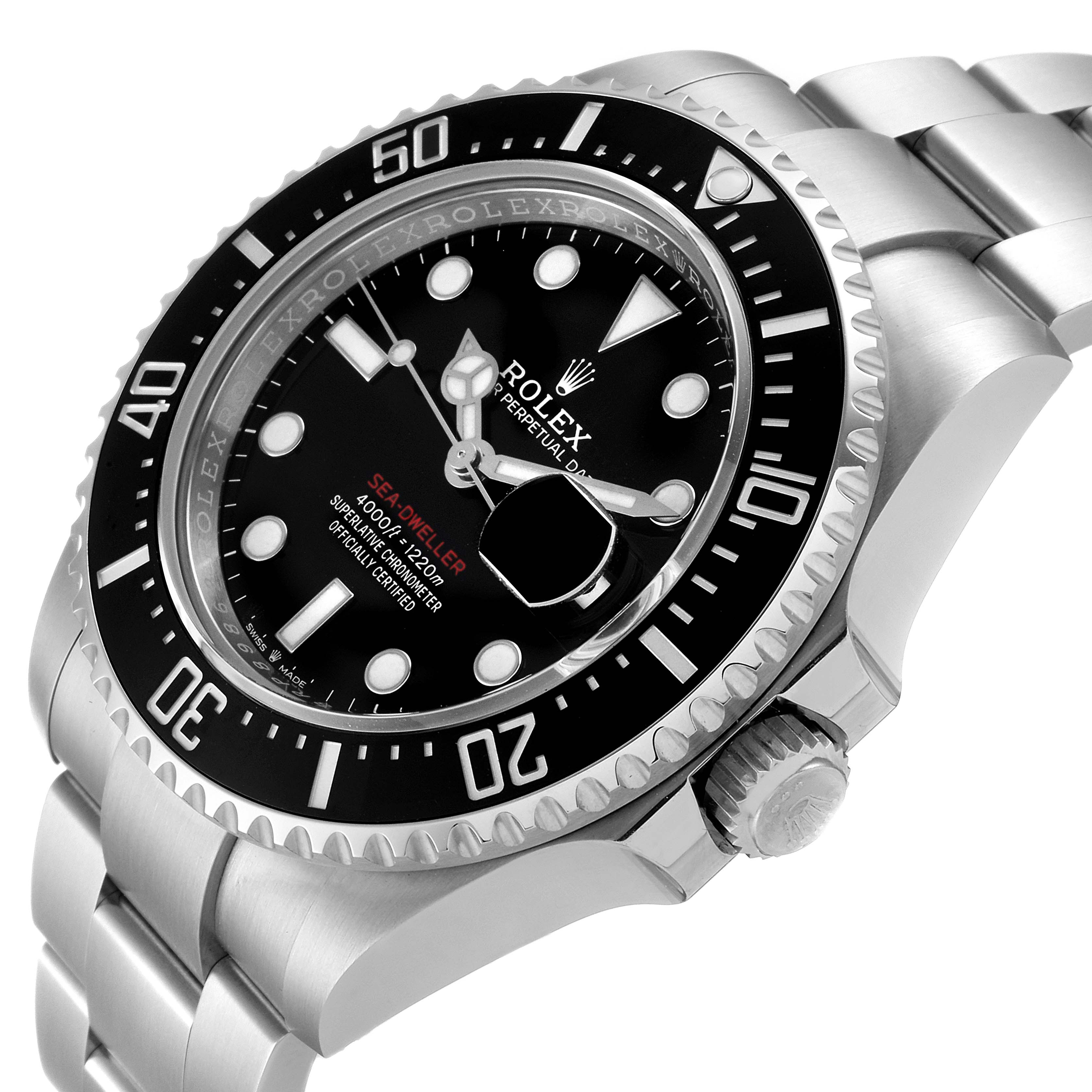 The image shows a Rolex Sea-Dweller 126600 Men
s Stainless Steel Black Dial 126600 Men
s Stainless Steel Black Dial watch at an angle displaying the bezel, crown, and part of the bracelet.