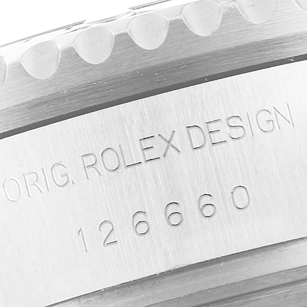 This image shows a close-up of the model and serial number engraving on the case side of a Rolex Sea-Dweller 126660 Men's Stainless Steel Blue Dial 126660 Men's Stainless Steel Blue Dial watch.