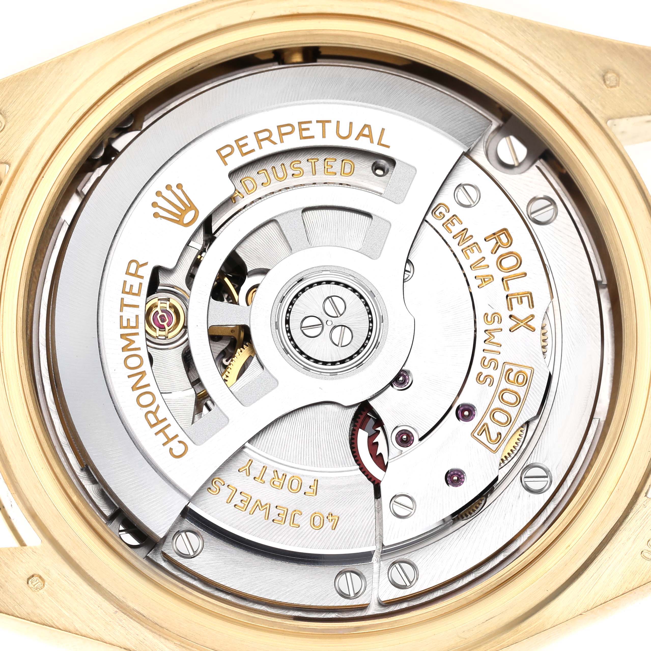 The image shows the movement of a Rolex Sky-Dweller 336938 Men's Yellow Gold Black Dial watch, highlighting the rotor and intricate mechanical parts.