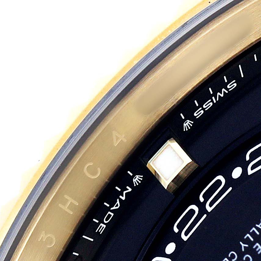 The image shows a close-up of the bezel and edge of the dial on a Rolex Sky-Dweller 336938 Men's Yellow Gold Black Dial watch.