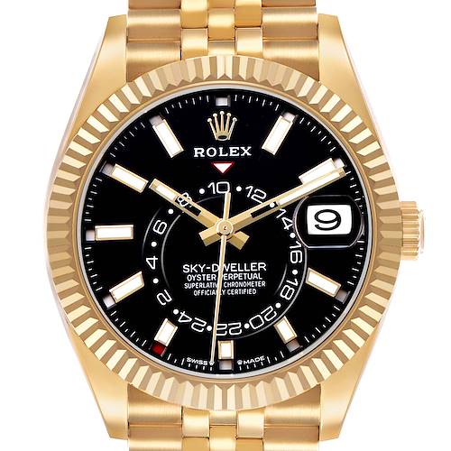 The Rolex Sky-Dweller 336938 Men's Yellow Gold Black Dial watch is shown from a front angle, highlighting the dial, bezel, and part of the bracelet.