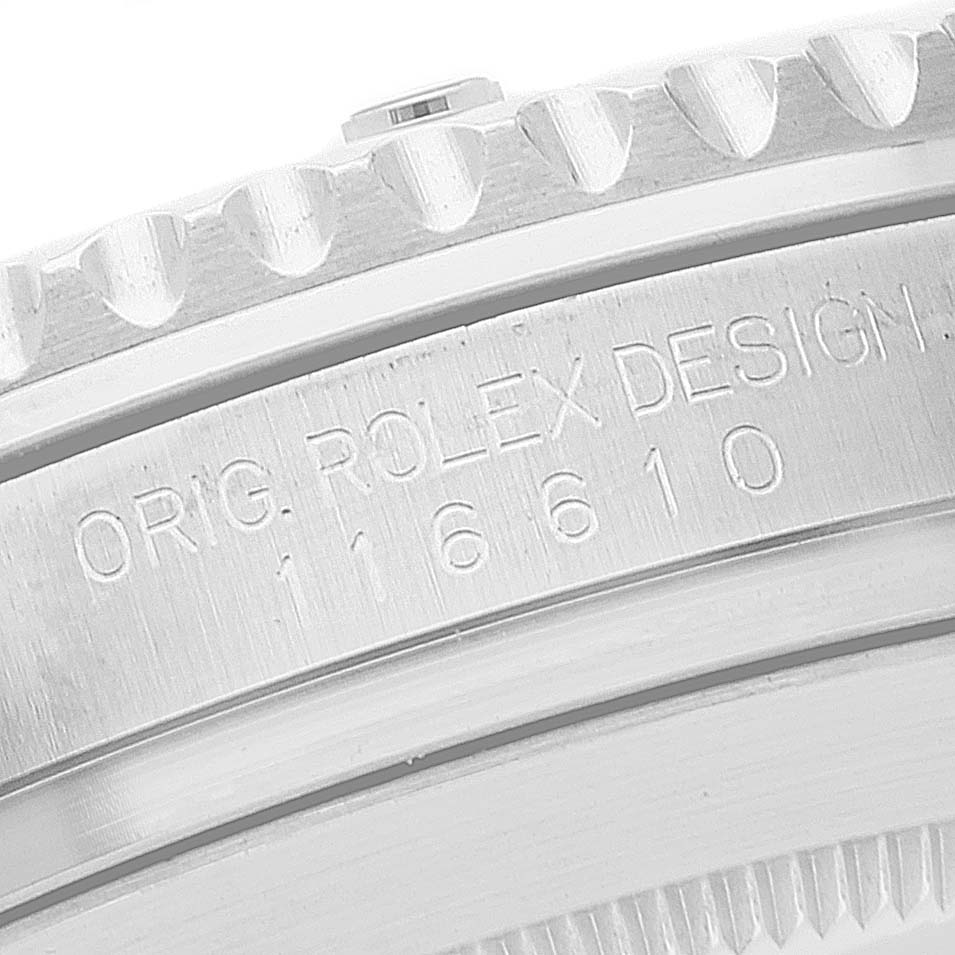 The image shows a close-up of the engraved side of the case and bezel teeth of a Rolex Submariner 116610 Men
s Stainless Steel Black Dial 116610 Men
s Stainless Steel Black Dial model 16610 watch.