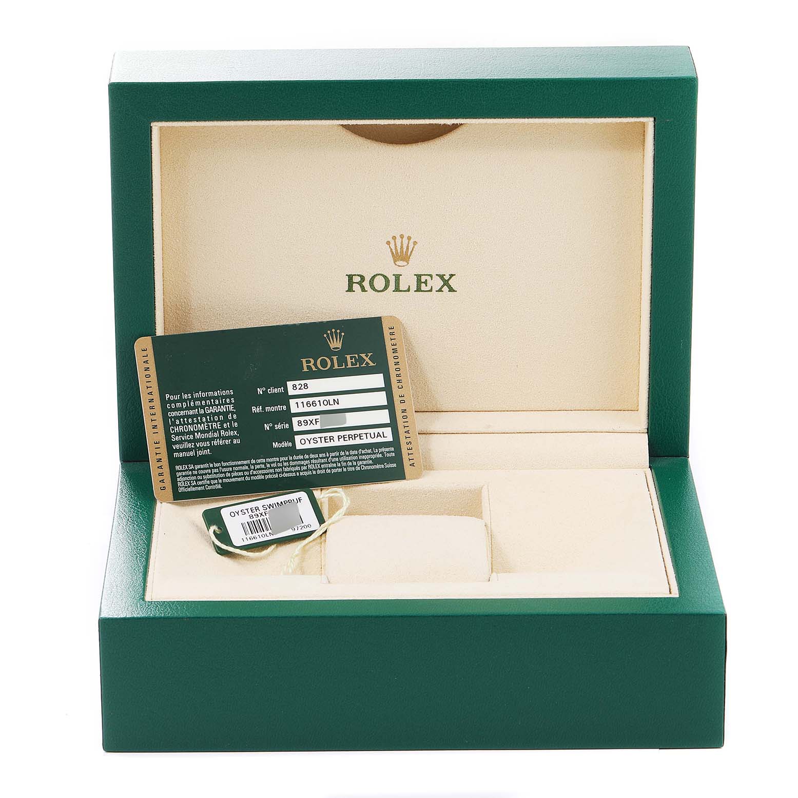 The image shows the open box of the Rolex Submariner 116610 Men
s Stainless Steel Black Dial 116610 Men
s Stainless Steel Black Dial, displaying warranty cards and a green tag inside.