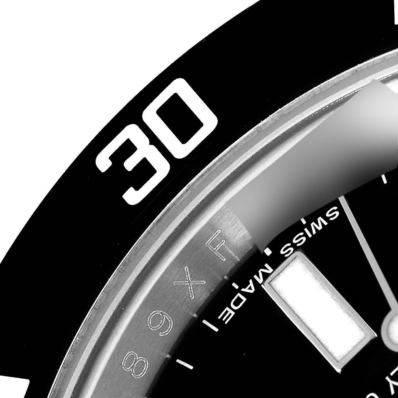 This close-up image of the Rolex Submariner 116610 Men
s Stainless Steel Black Dial 116610 Men
s Stainless Steel Black Dial shows the 30-minute mark and part of the dial with "Swiss Made" text.