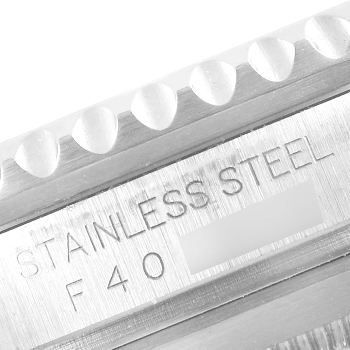 The image shows a close-up of the stainless steel case and bezel edge of a Rolex Submariner 16610 Men
s Stainless Steel Black Dial 16610 Men
s Stainless Steel Black Dial watch.