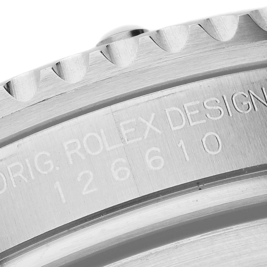 The image shows a close-up of the engraved case side of a Rolex Submariner 126610LN Men's Stainless Steel Black Dial, featuring its reference number.