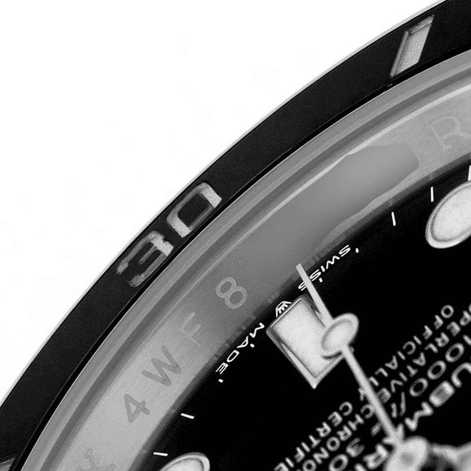 The image shows a close-up of the Rolex Submariner 126610LN Men's Stainless Steel Black Dial's dial and bezel, focusing on the hour markers and hands.