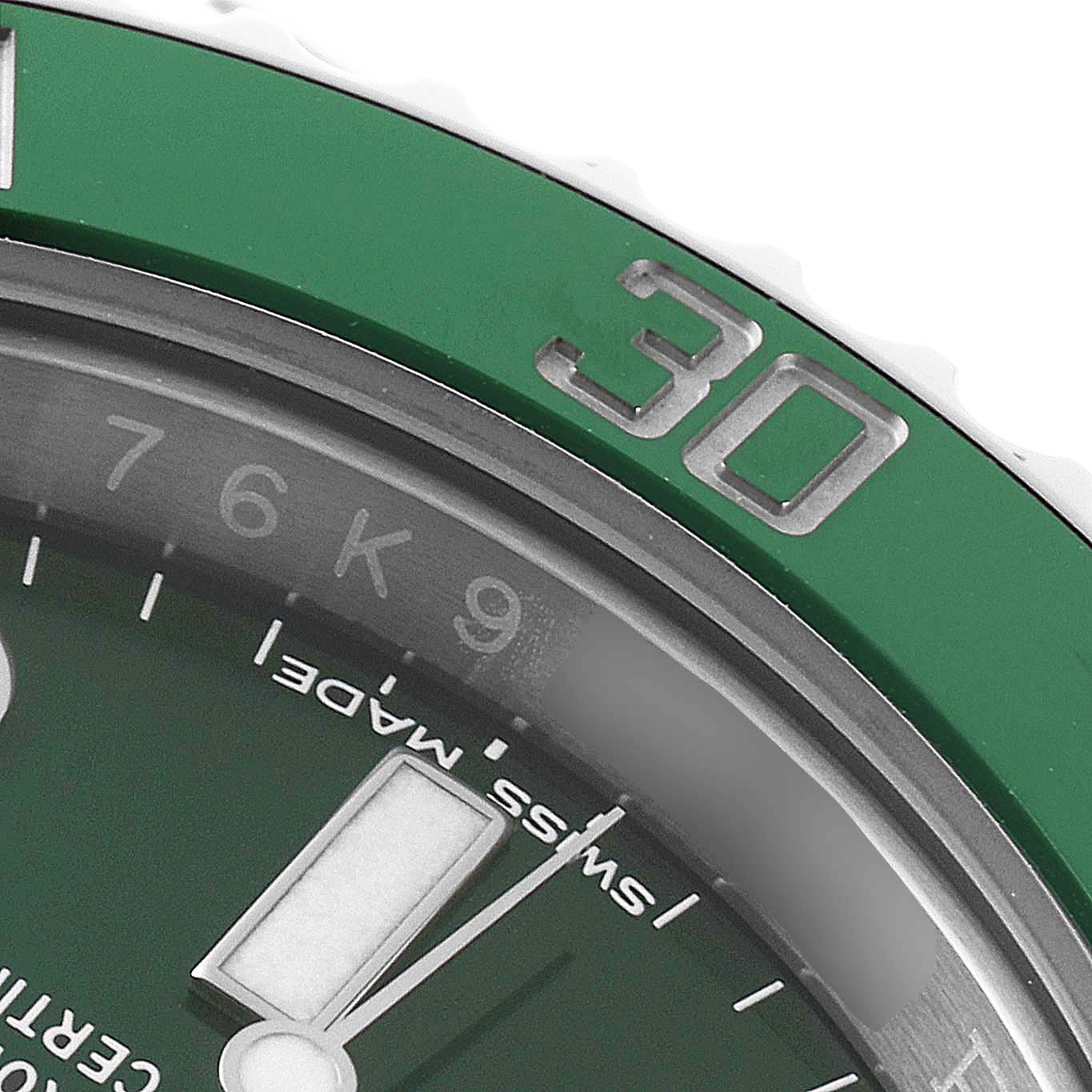 This close-up of the Rolex Submariner 116610LV Men
s Stainless Steel Green Dial 116610LV Men
s Stainless Steel Green Dial shows part of the green bezel, the 
30
 marker, and part of the green dial with indices.