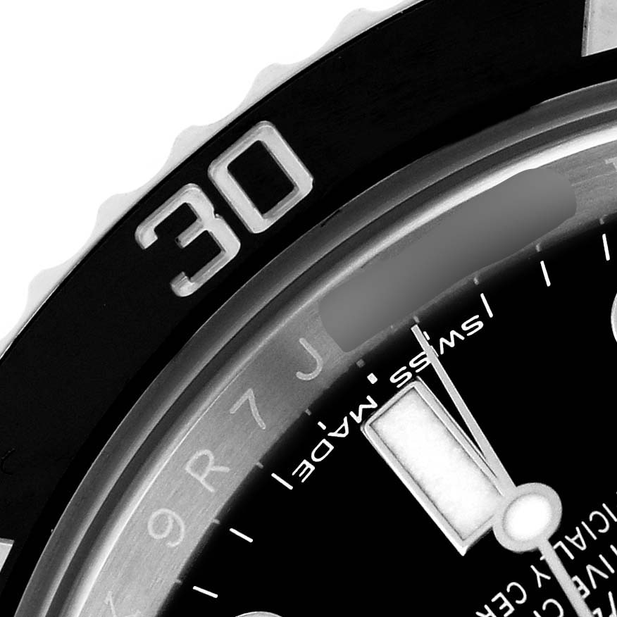The image shows a close-up of the bezel and dial of a Rolex Submariner 114060 Men's Stainless Steel Black Dial, focusing on the "30" marking and part of the minute hand.
