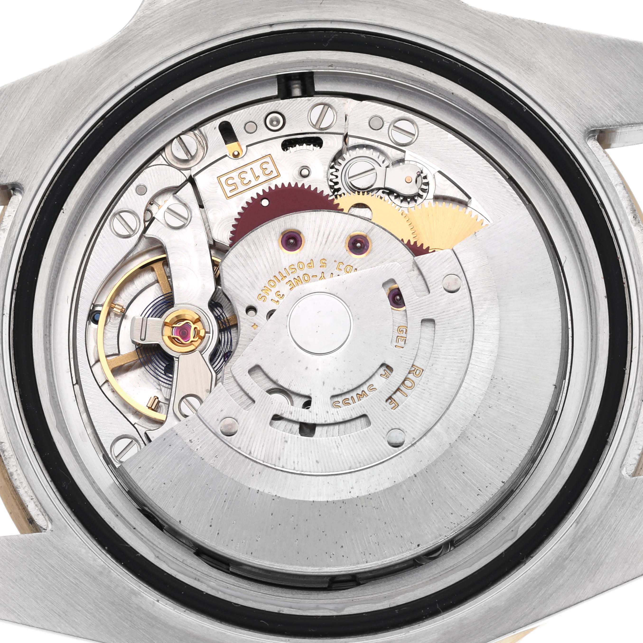The image shows the movement components of a Rolex Submariner 116613 Men
s Steel and Gold (two tone) Blue Dial 116613 Men
s Steel and Gold (two tone) Blue Dial watch from a back view.