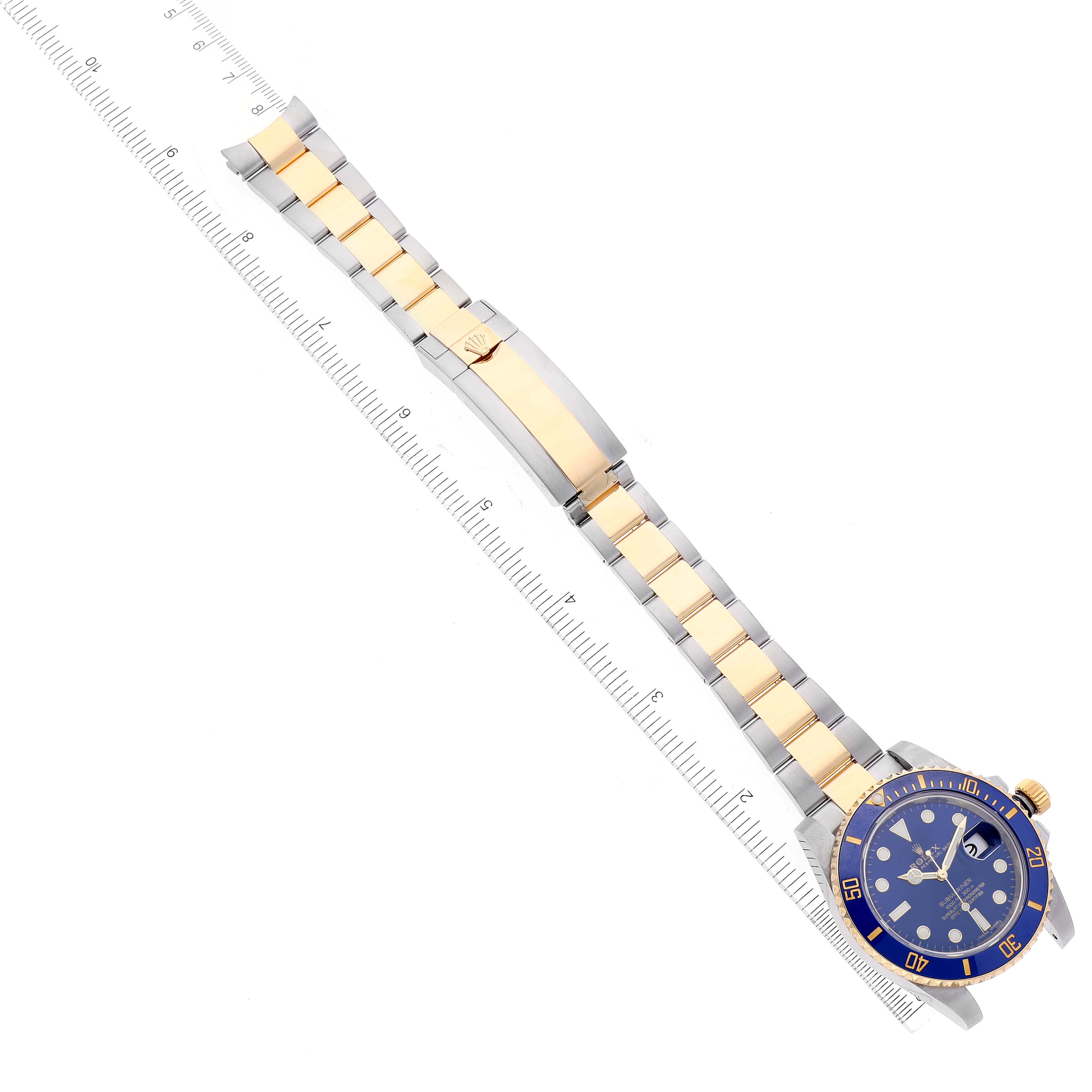 The Rolex Submariner 116613 Men
s Steel and Gold (two tone) Blue Dial 116613 Men
s Steel and Gold (two tone) Blue Dial watch is shown at a top-down angle, displaying its blue dial, bezel, and two-tone stainless steel and gold bracelet.
