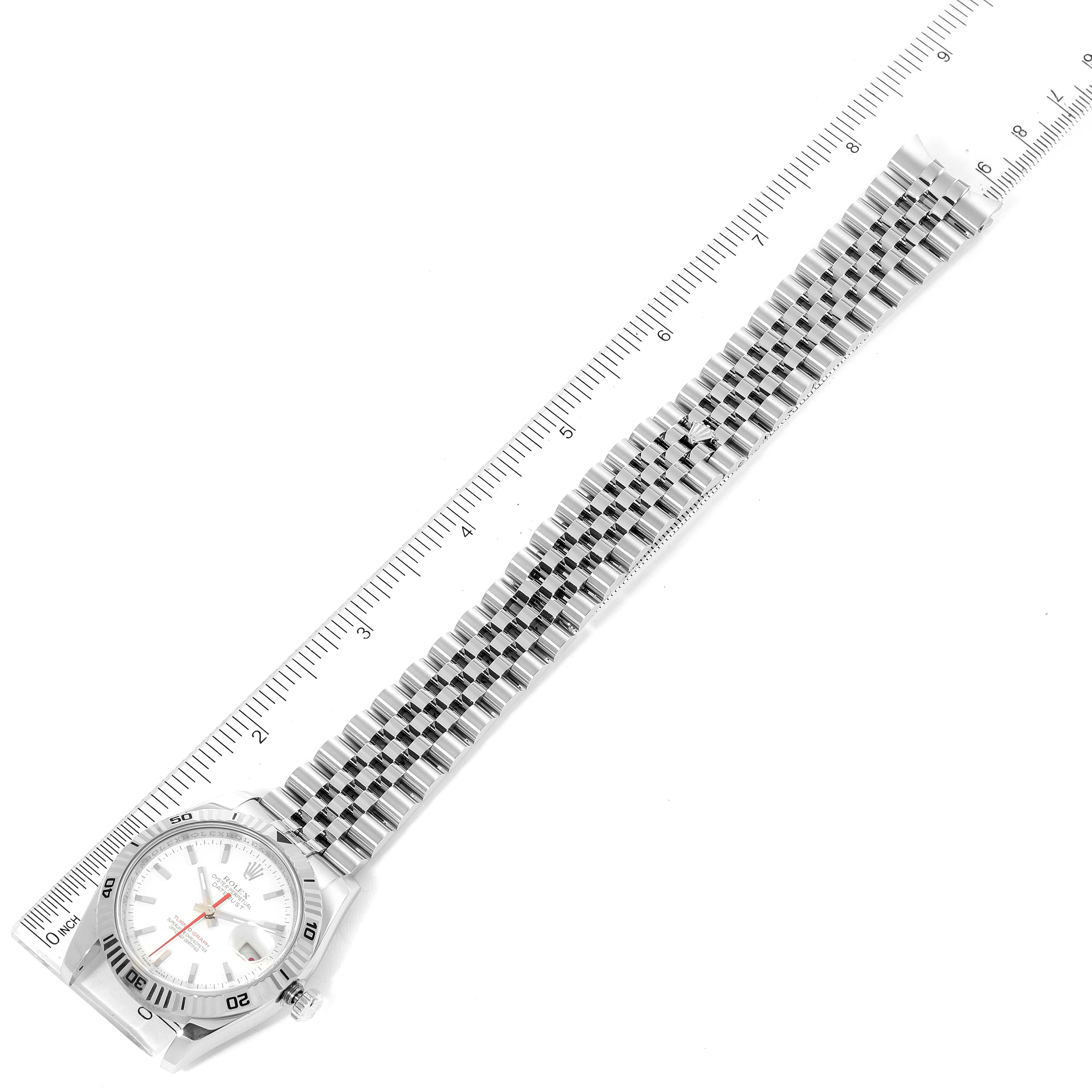 The image shows a top-down view of the Rolex Turn-o-Graph 116264 Men
s Stainless Steel White Dial 116264 Men
s Stainless Steel White Dial watch, highlighting the full bracelet, face, and bezel alongside a ruler.