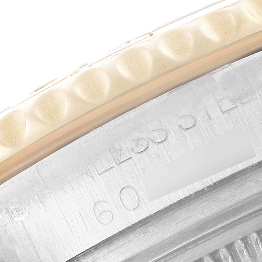 This close-up image shows part of the bezel and case back of a Rolex Yacht-Master 68623 Men
s Steel and Gold (two tone) White Dial 68623 Men
s Steel and Gold (two tone) White Dial watch.