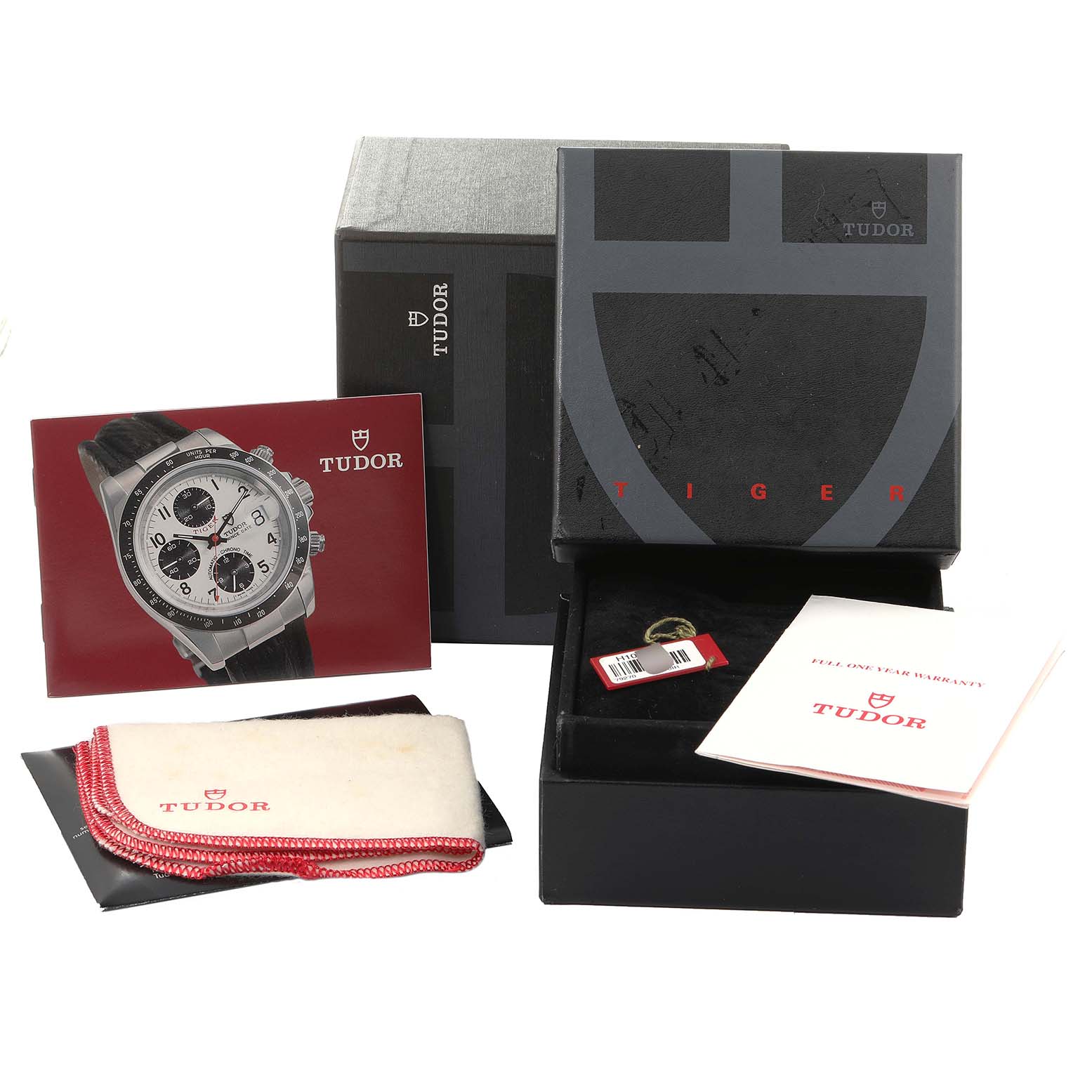 The image shows accessories for a Tudor Prince model watch, including the box, booklet, cleaning cloth, tag, and warranty card.