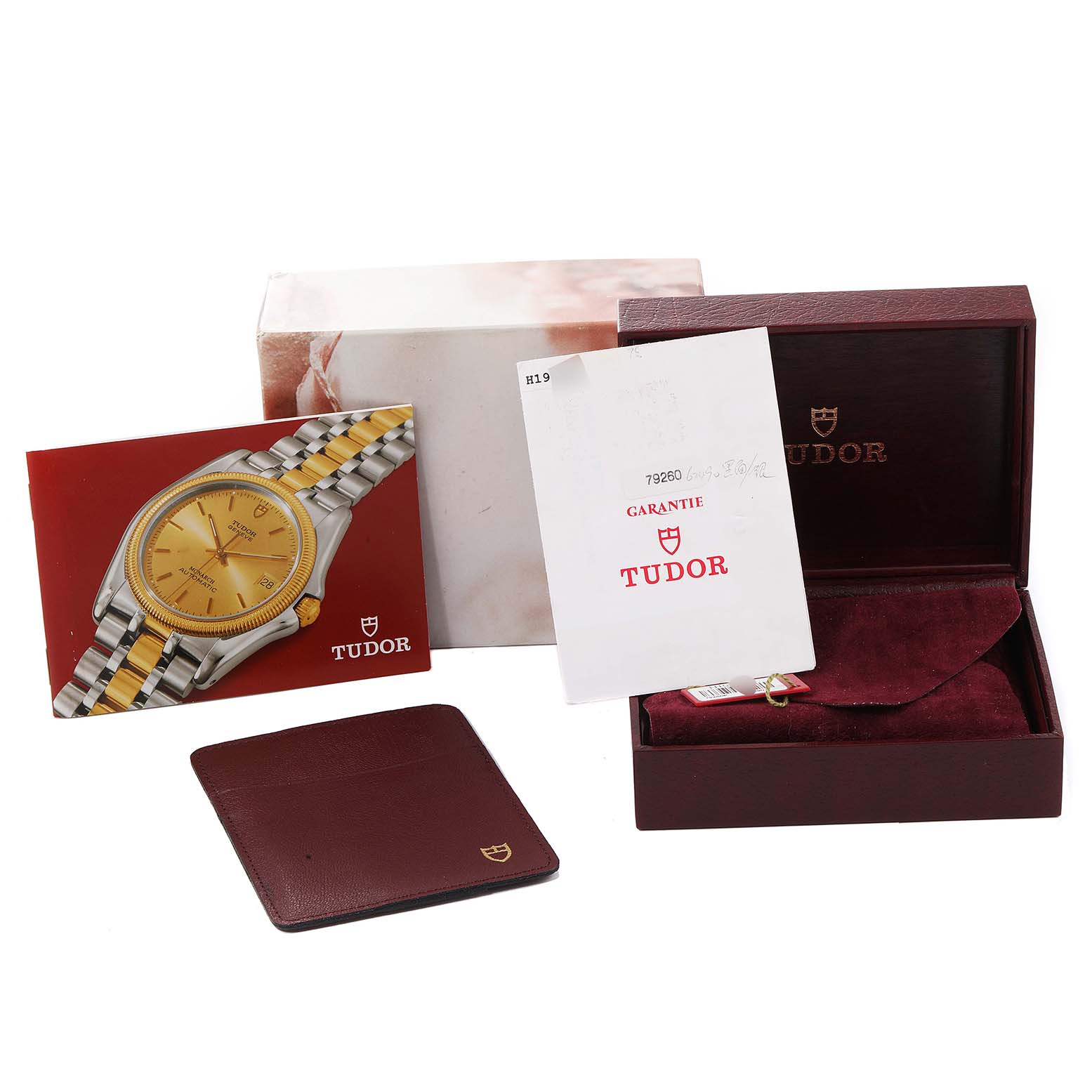The image shows a Tudor Prince model watch box, instruction manual, warranty card, and cardholder.
