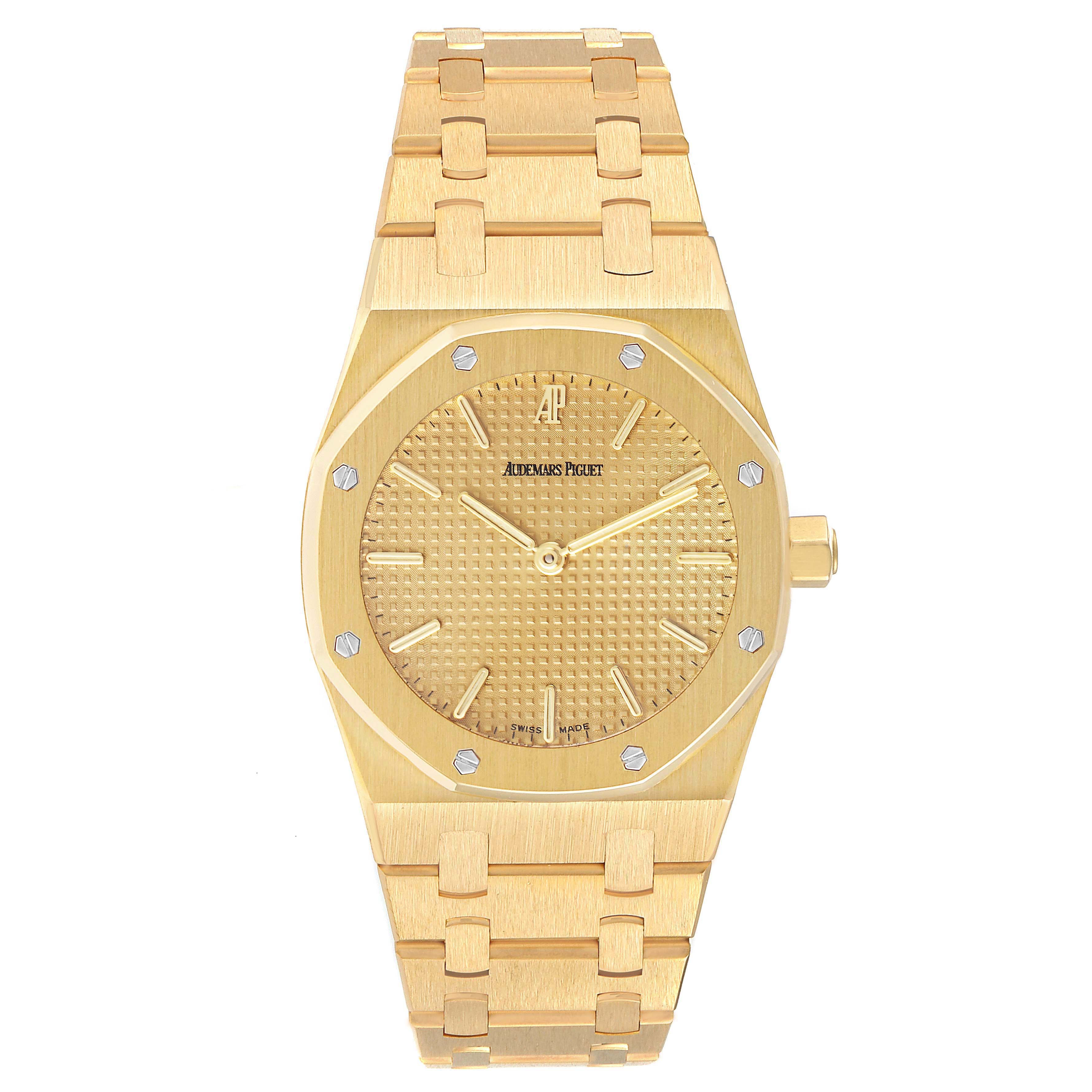 The image shows a front view of the Audemars Piguet Royal Oak Men's Yellow Gold Champagne Dial Men's Yellow Gold Champagne Dial watch, displaying its face, bezel, and bracelet.