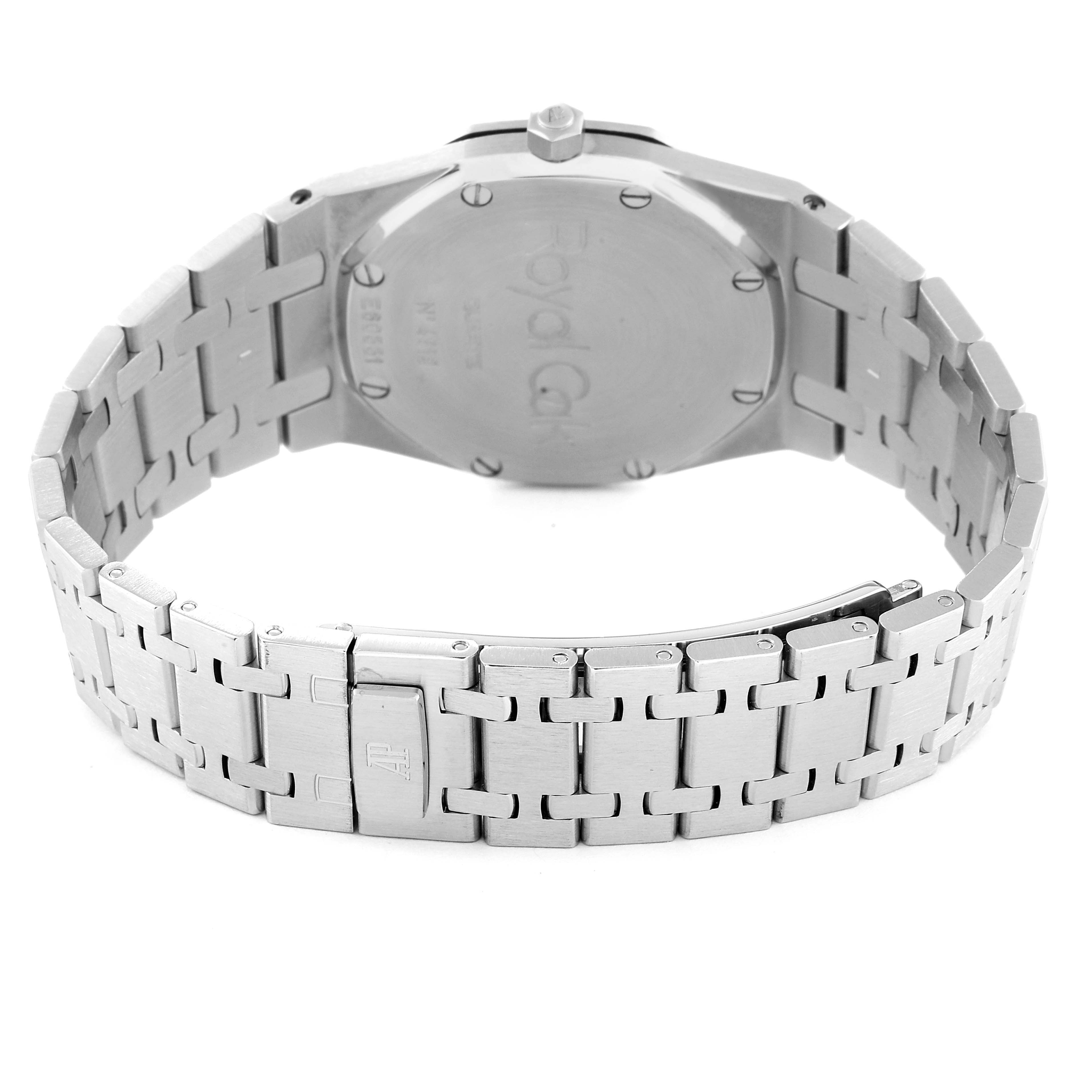 The image shows the back view of a Royal Oak by Audemars Piguet, highlighting the case back and bracelet.