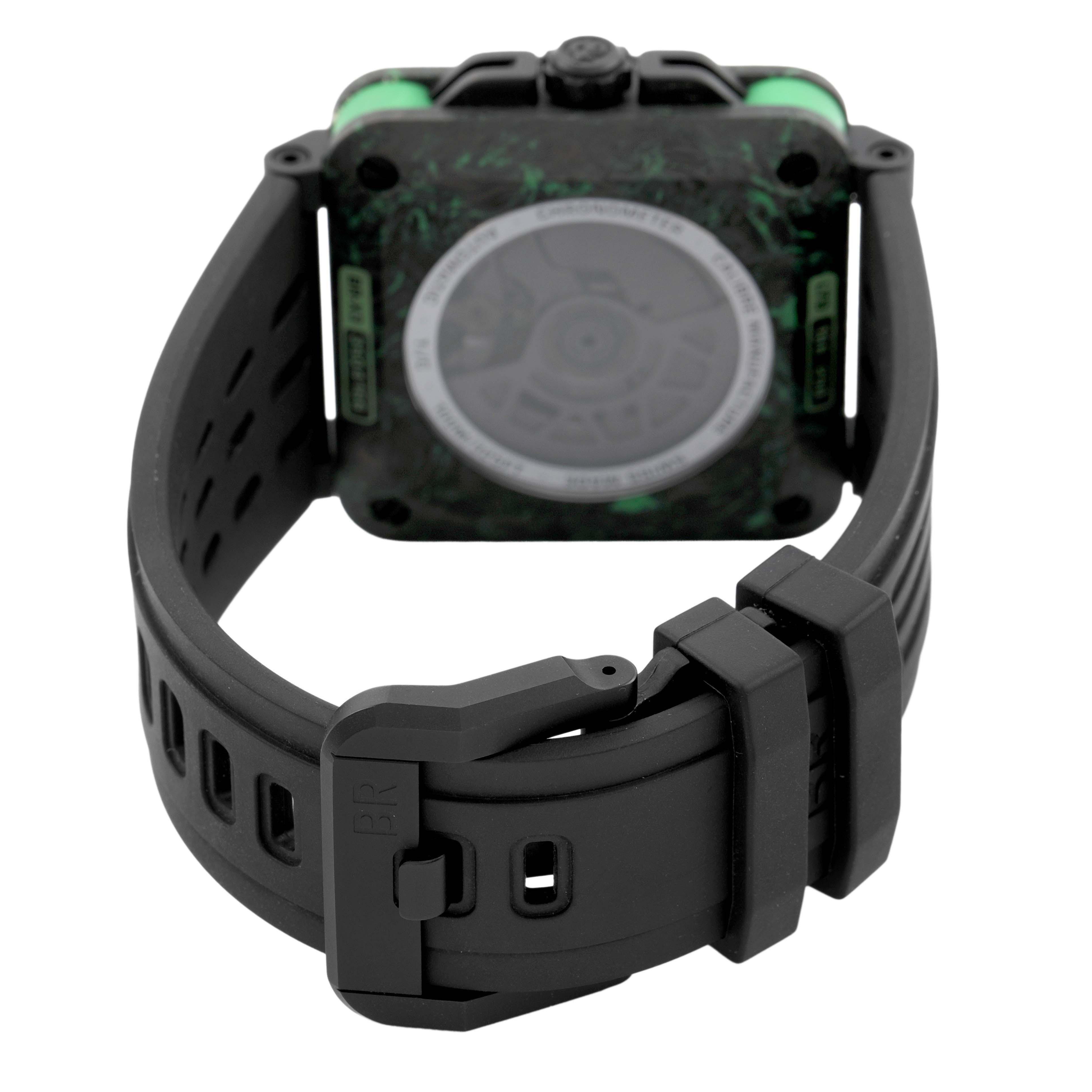 The image shows the back and clasp of a Bell & Ross Instruments BRX3R-GN-CA/SRB Men's Titanium Transparent Dial watch, highlighting its strap and square case.