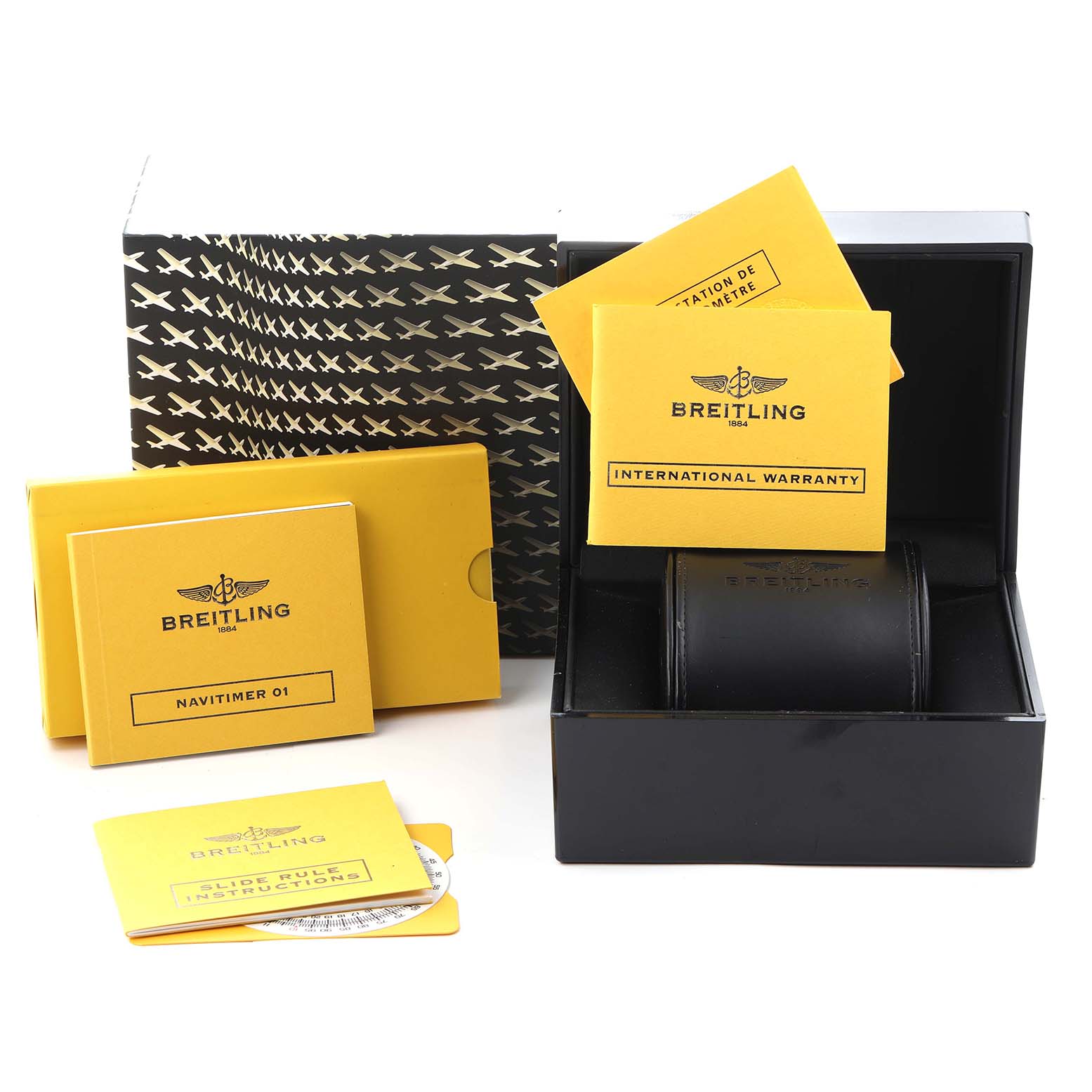 The image shows Breitling Navitimer AB0120 Men
s Stainless Steel Black Dial AB0120 Men
s Stainless Steel Black Dial packaging and accessories, including the box, manuals, and warranty cards, at an angled view.