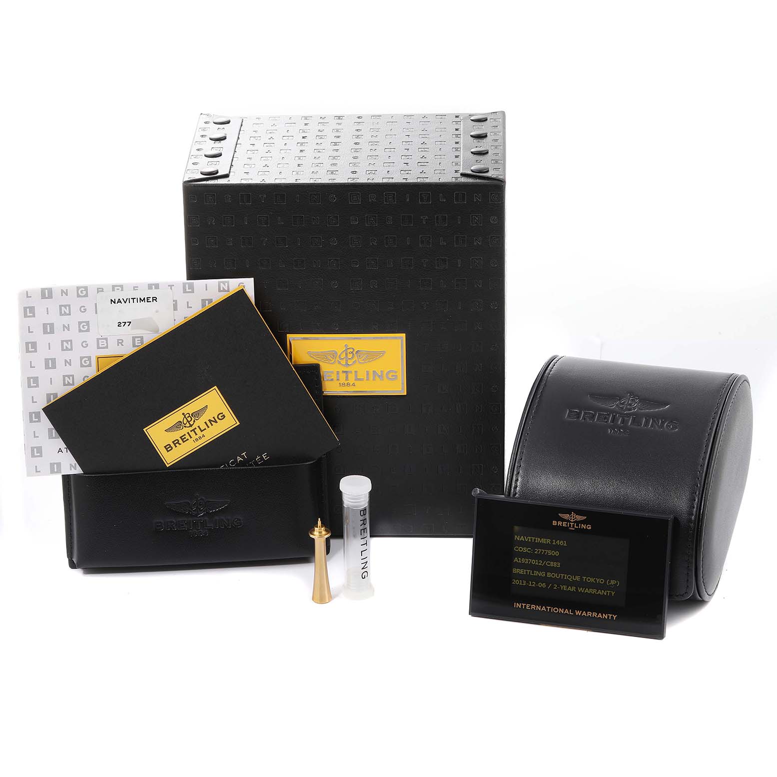 The image shows the packaging and accessories of a Breitling Navitimer A19370 Men's Stainless Steel Blue Dial A19370 Men's Stainless Steel Blue Dial watch, including the box, manuals, case, and warranty card.