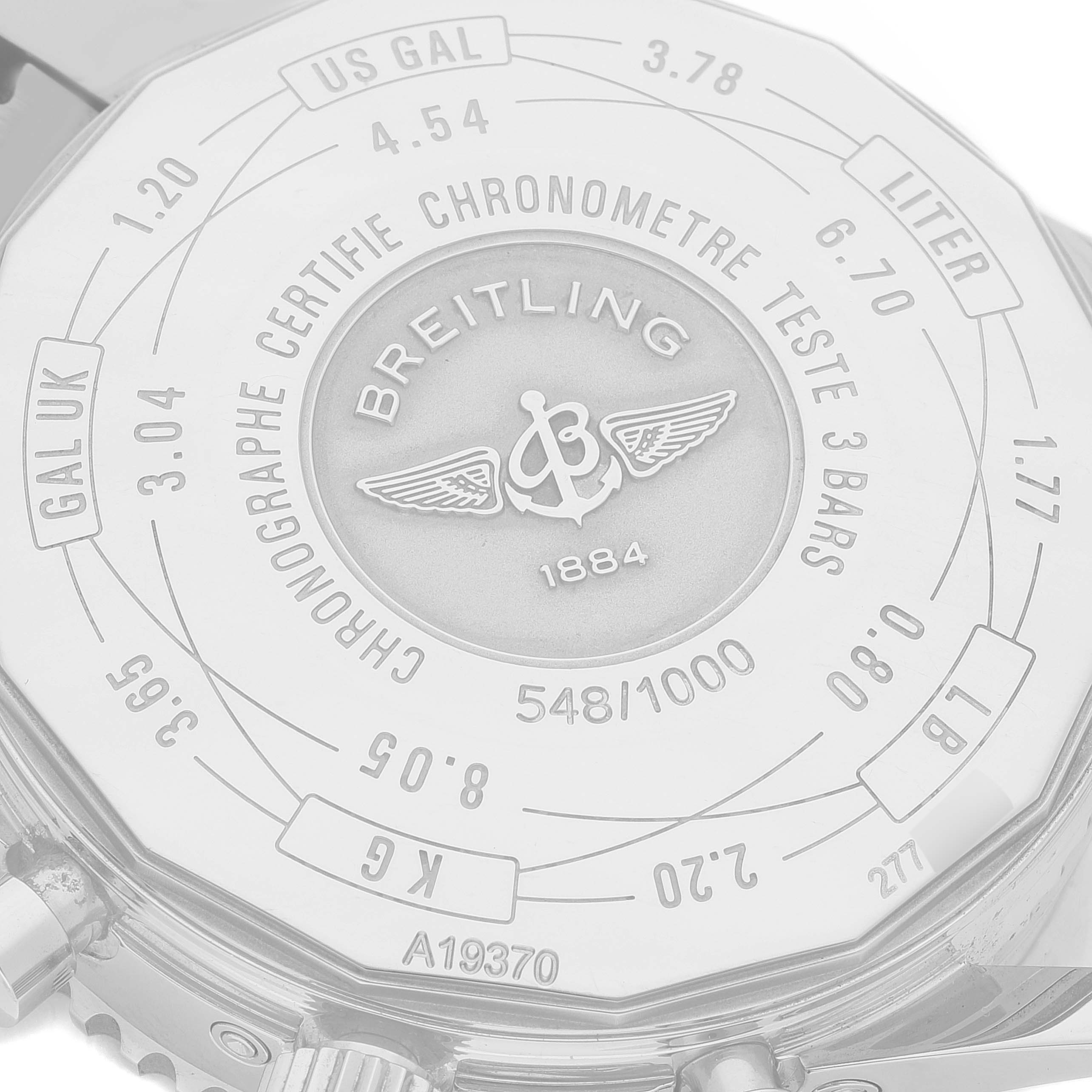 The image shows the back case of a Breitling Navitimer A19370 Men's Stainless Steel Blue Dial A19370 Men's Stainless Steel Blue Dial watch, highlighting engravings and measurement conversions.