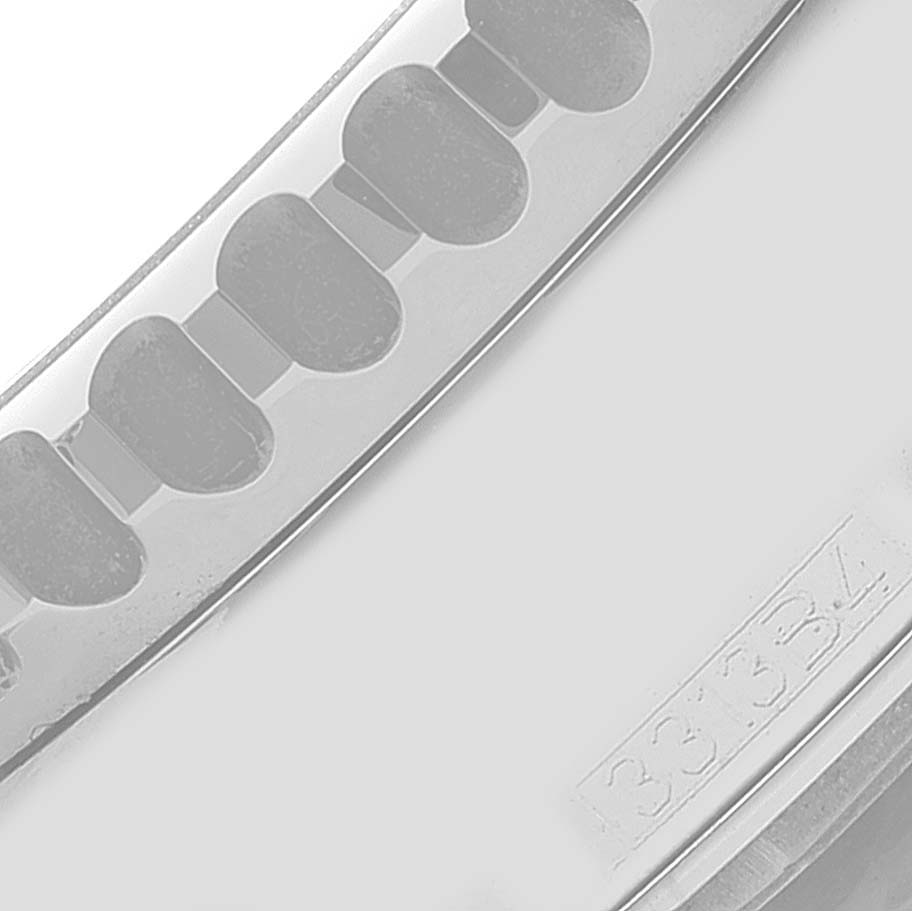 This close-up image shows a part of the bezel or case edge of a Breitling Navitimer A19370 Men's Stainless Steel Blue Dial A19370 Men's Stainless Steel Blue Dial watch, highlighting its engraved detailing.