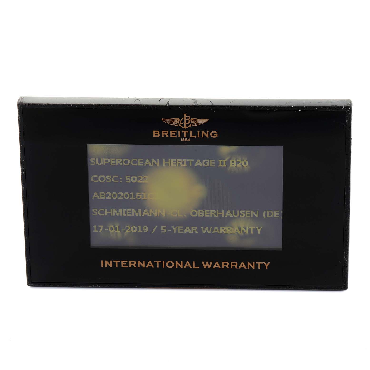 The image shows an International Warranty card for a Breitling Superocean AB202016-C961-152A Men
s Stainless Steel Blue Dial AB202016-C961-152A Men
s Stainless Steel Blue Dial Heritage II B20 watch, displayed frontally.