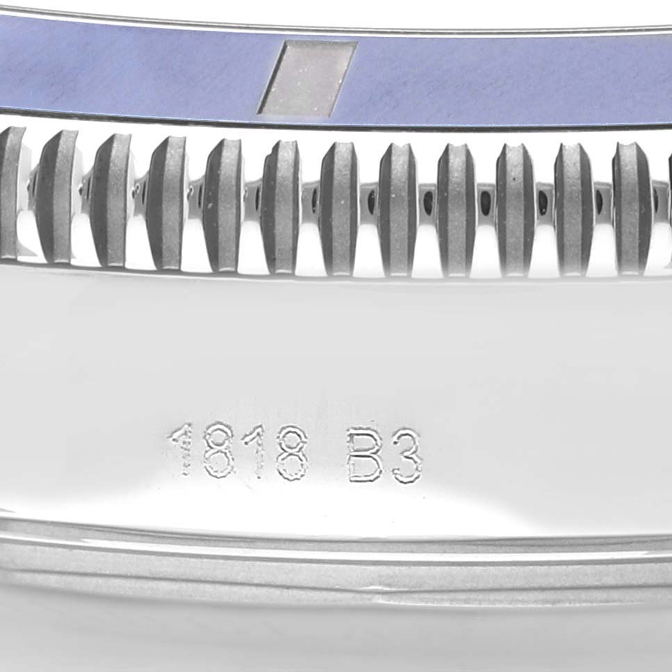 This image shows the side profile of a Breitling Superocean AB202016-C961-152A Men
s Stainless Steel Blue Dial AB202016-C961-152A Men
s Stainless Steel Blue Dial watch crown, bezel, and part of the case, including an engraving.