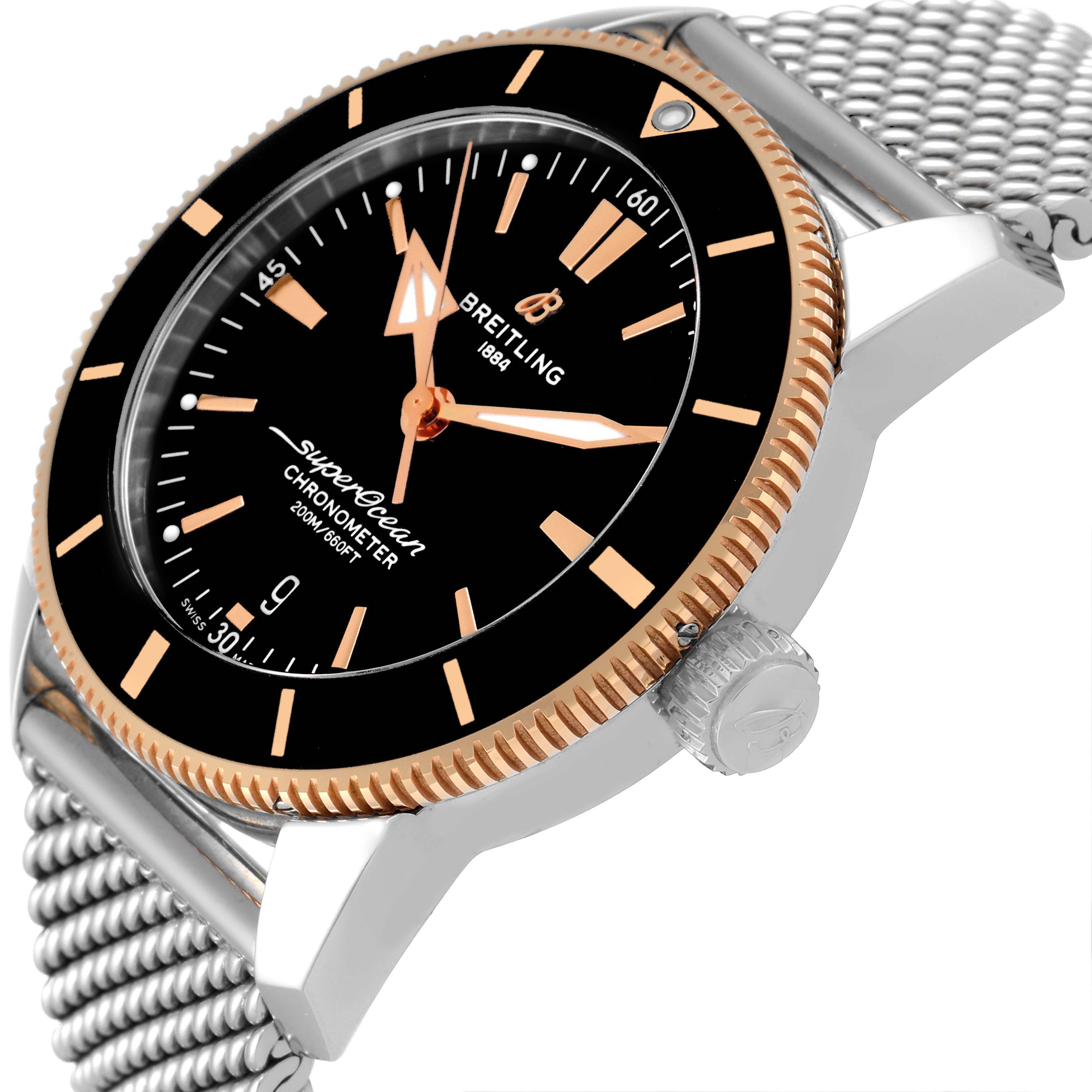 The image shows a side angle of the Breitling Superocean UB2030121B1A1 Men's Steel and Gold (two tone) Black Dial UB2030121B1A1 Men's Steel and Gold (two tone) Black Dial watch, highlighting the dial, bezel, crown, and mesh bracelet.