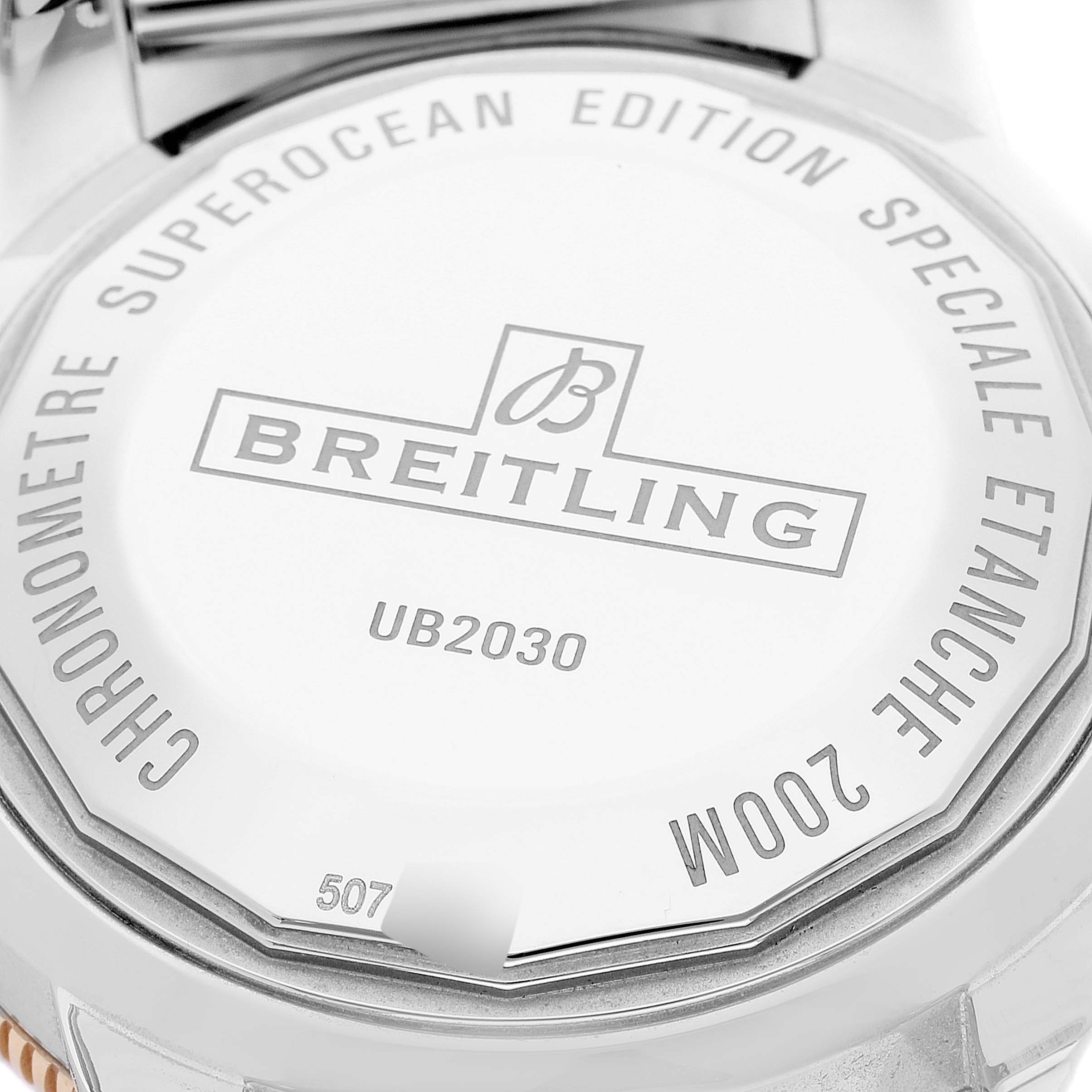 The image shows the back case of a Breitling Superocean UB2030121B1A1 Men's Steel and Gold (two tone) Black Dial UB2030121B1A1 Men's Steel and Gold (two tone) Black Dial watch, highlighting the brand name, model number (UB2030), and water resistance details (200M).