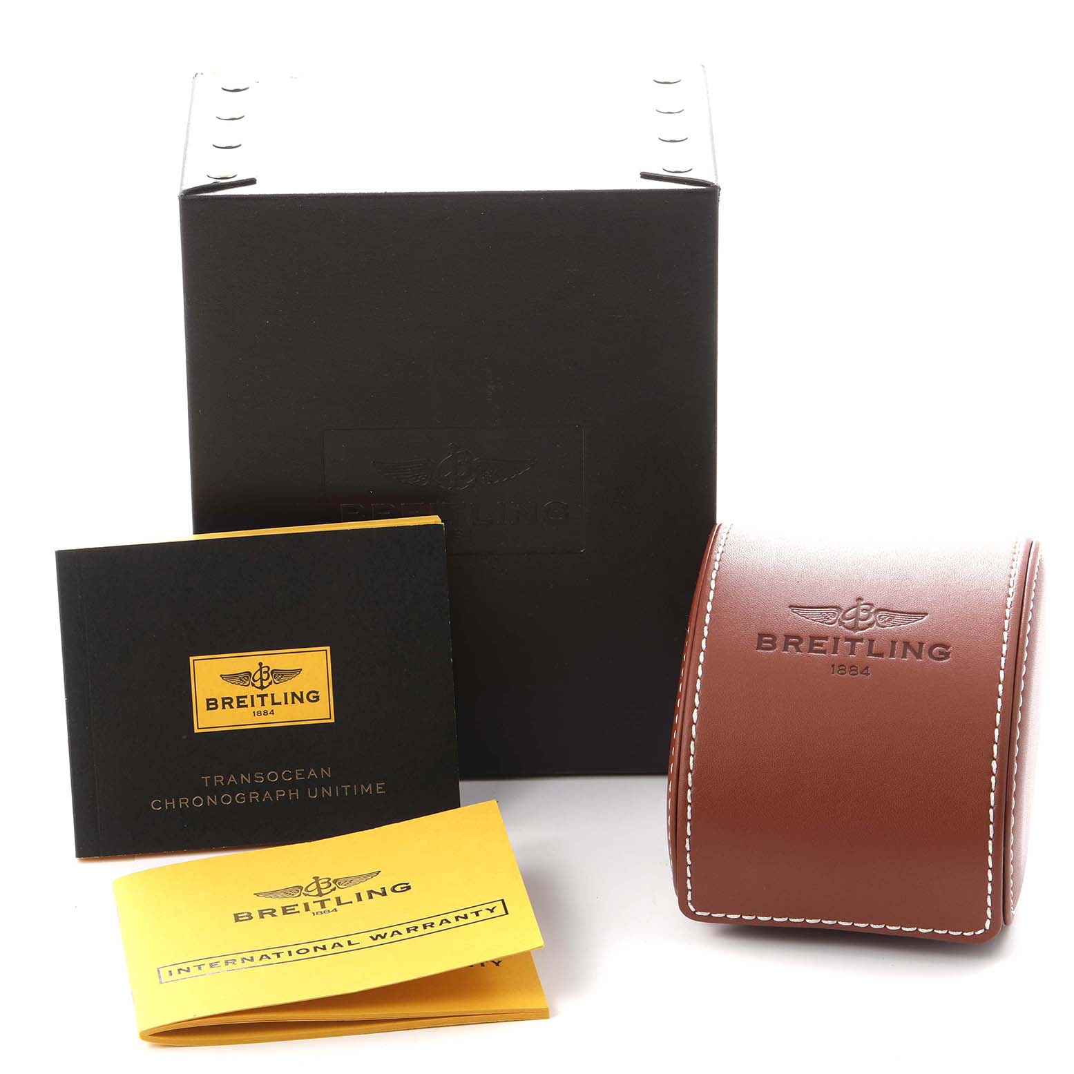 The image shows a Breitling Transocean AB0510U9/C879 Men's Stainless Steel Blue Dial AB0510U9/C879 Men's Stainless Steel Blue Dial box, leather case, and warranty documents from a front angle.