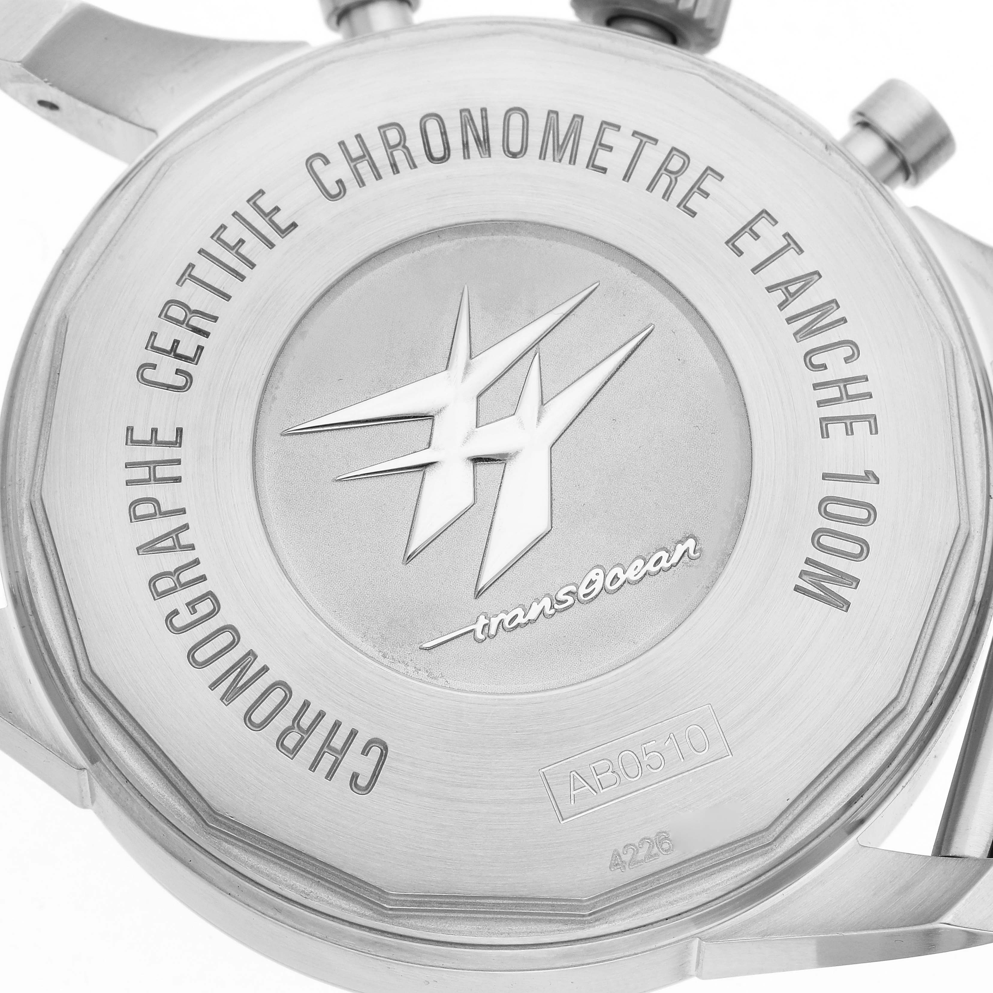 The image shows the back case of the Breitling Transocean AB0510U9/C879 Men's Stainless Steel Blue Dial AB0510U9/C879 Men's Stainless Steel Blue Dial watch, highlighting the engravings and logo.