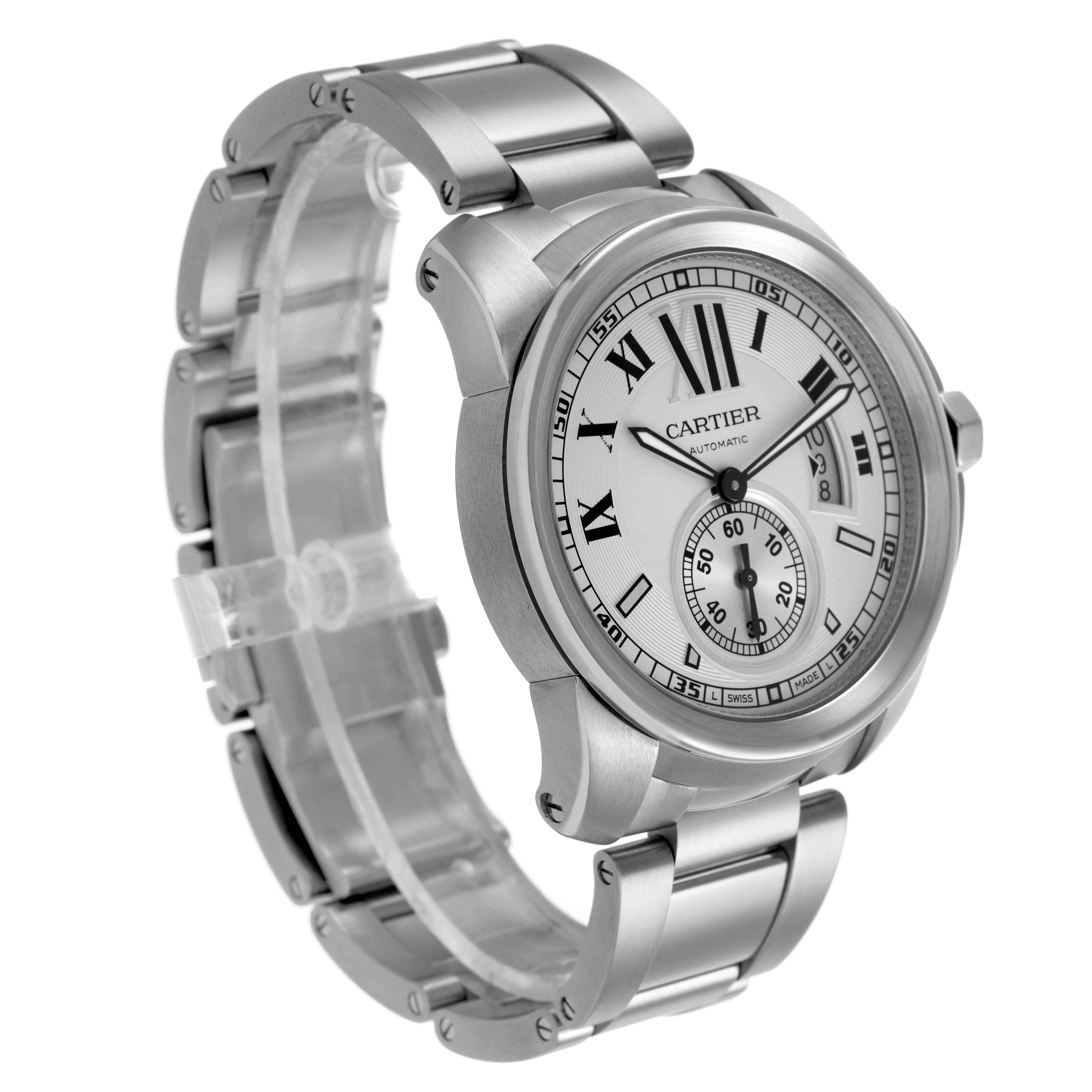 The Calibre de Cartier watch is shown at a three-quarter angle highlighting the face, bezel, and metal bracelet.