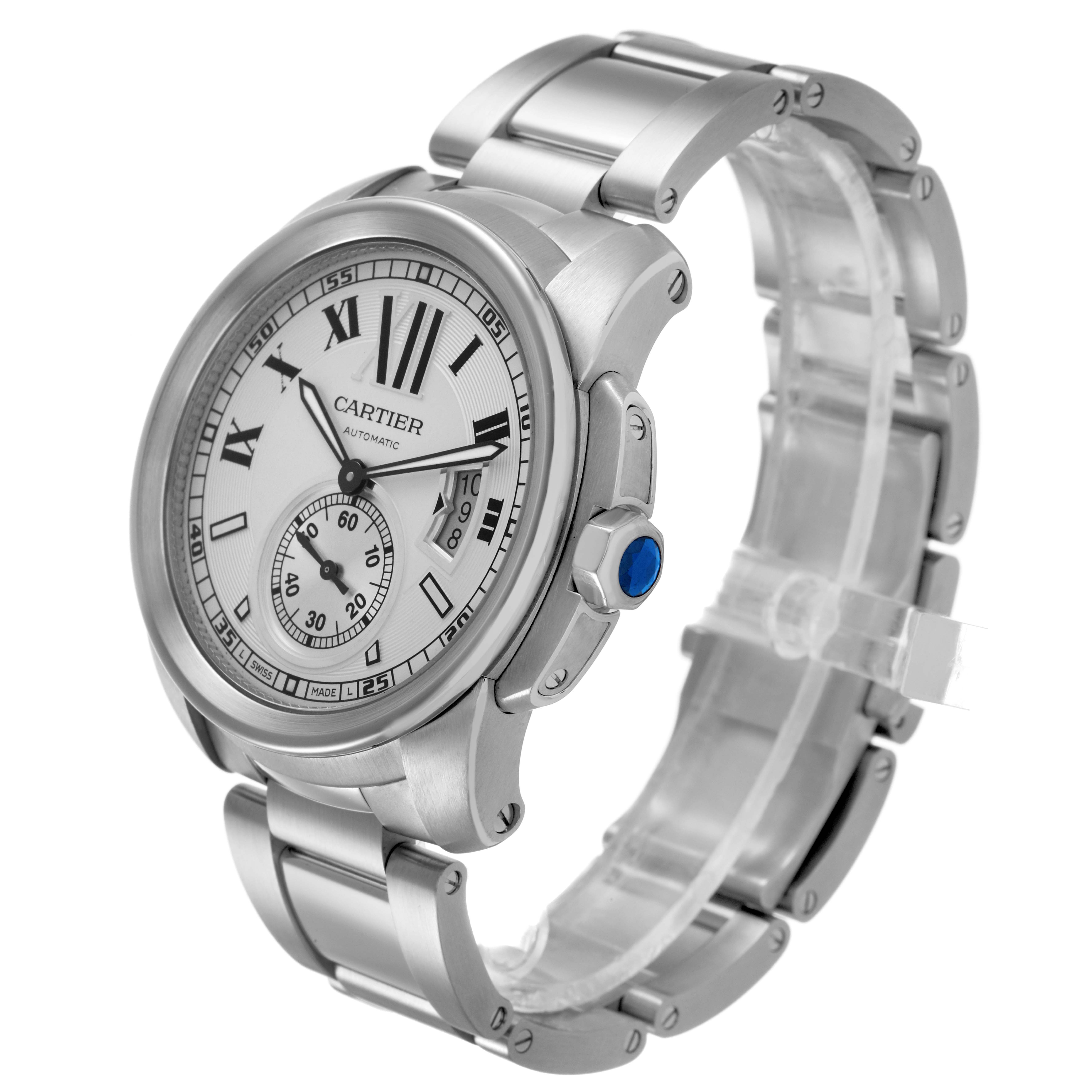 The Calibre de Cartier watch is shown at a three-quarter angle, highlighting the face, bezel, and metal bracelet.