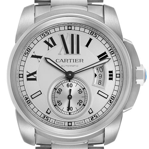 The Calibre de Cartier watch is shown from a front angle, highlighting its face, Roman numerals, subdial, and date window.