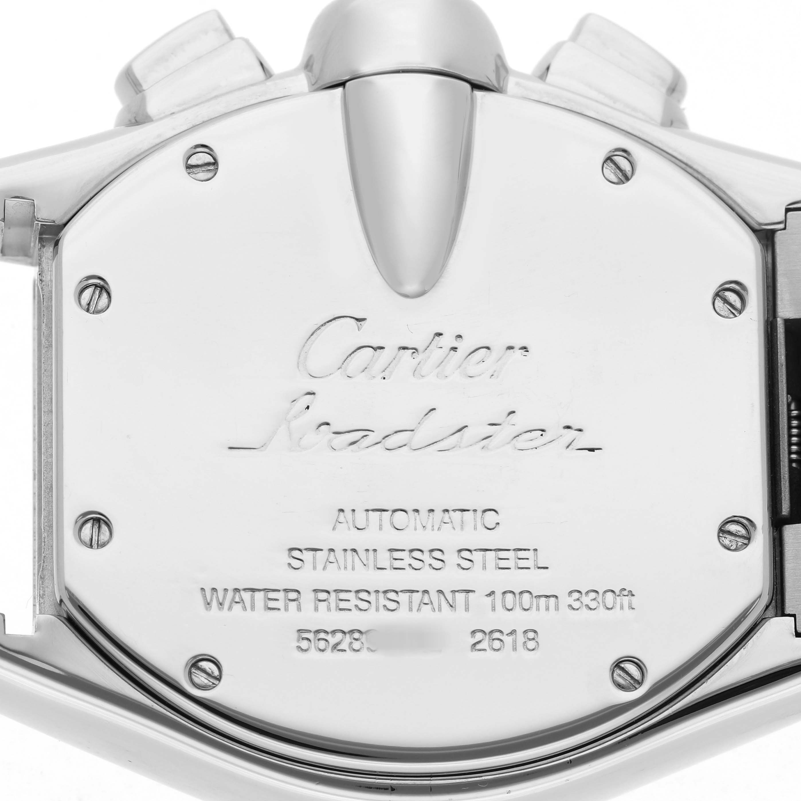 The image shows the backside of a Cartier Roadster W62019X6 Men's Stainless Steel Silver Dial watch, highlighting the case back with engravings and screws.