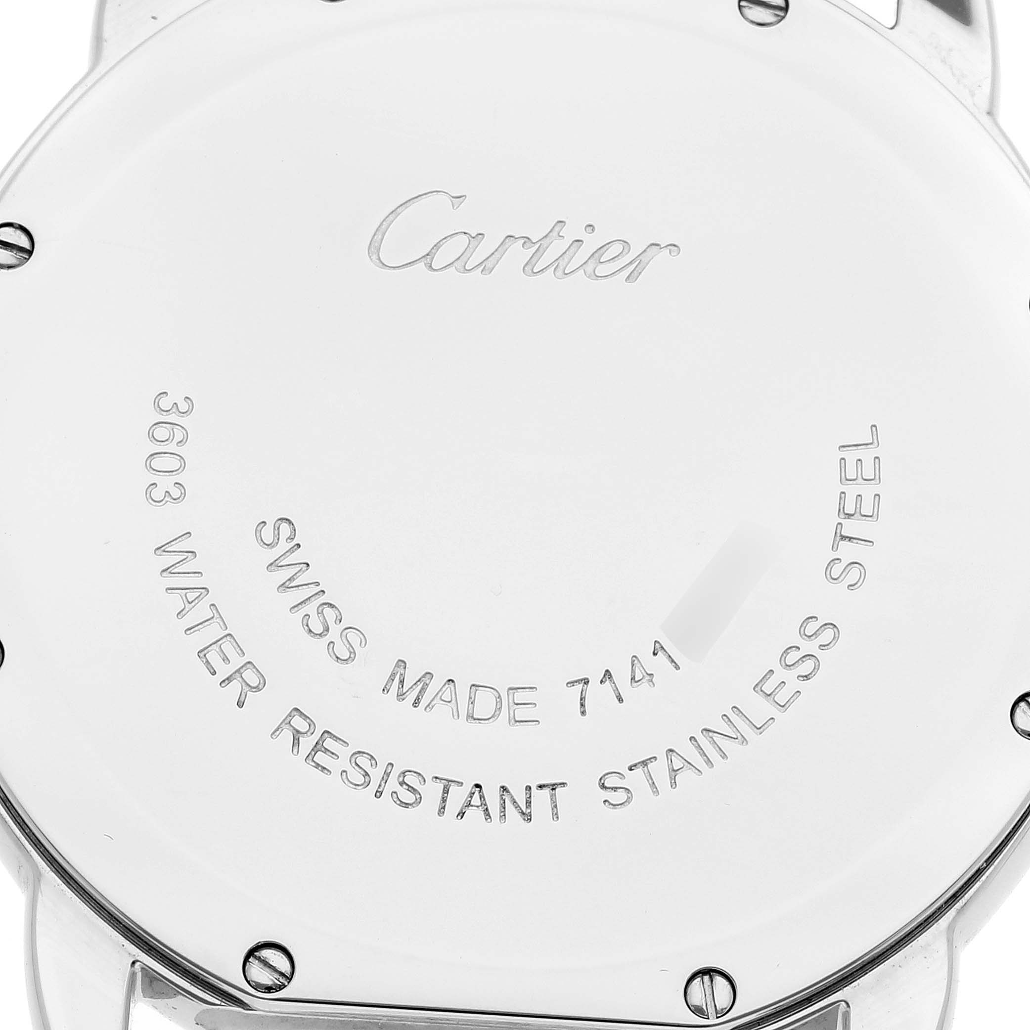 The image shows the back of a Cartier Ronde W6701005 Men
s Stainless Steel Silver Dial W6701005 Men
s Stainless Steel Silver Dial watch with engraving details and screws visible.