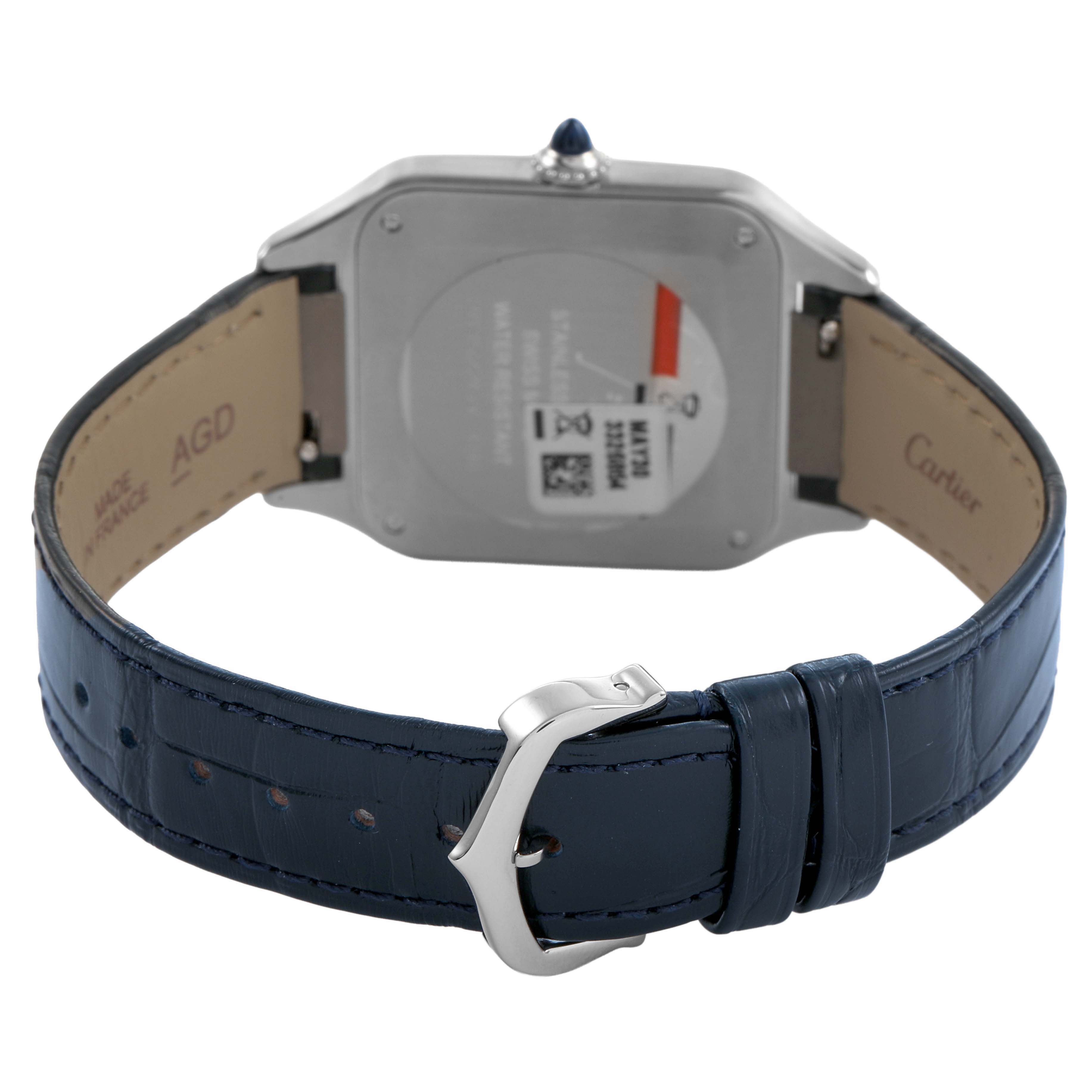 The image shows the back and clasp of a Cartier Santos Dumont WSSA0085 Men's Stainless Steel Silver Dial watch with a blue leather strap.