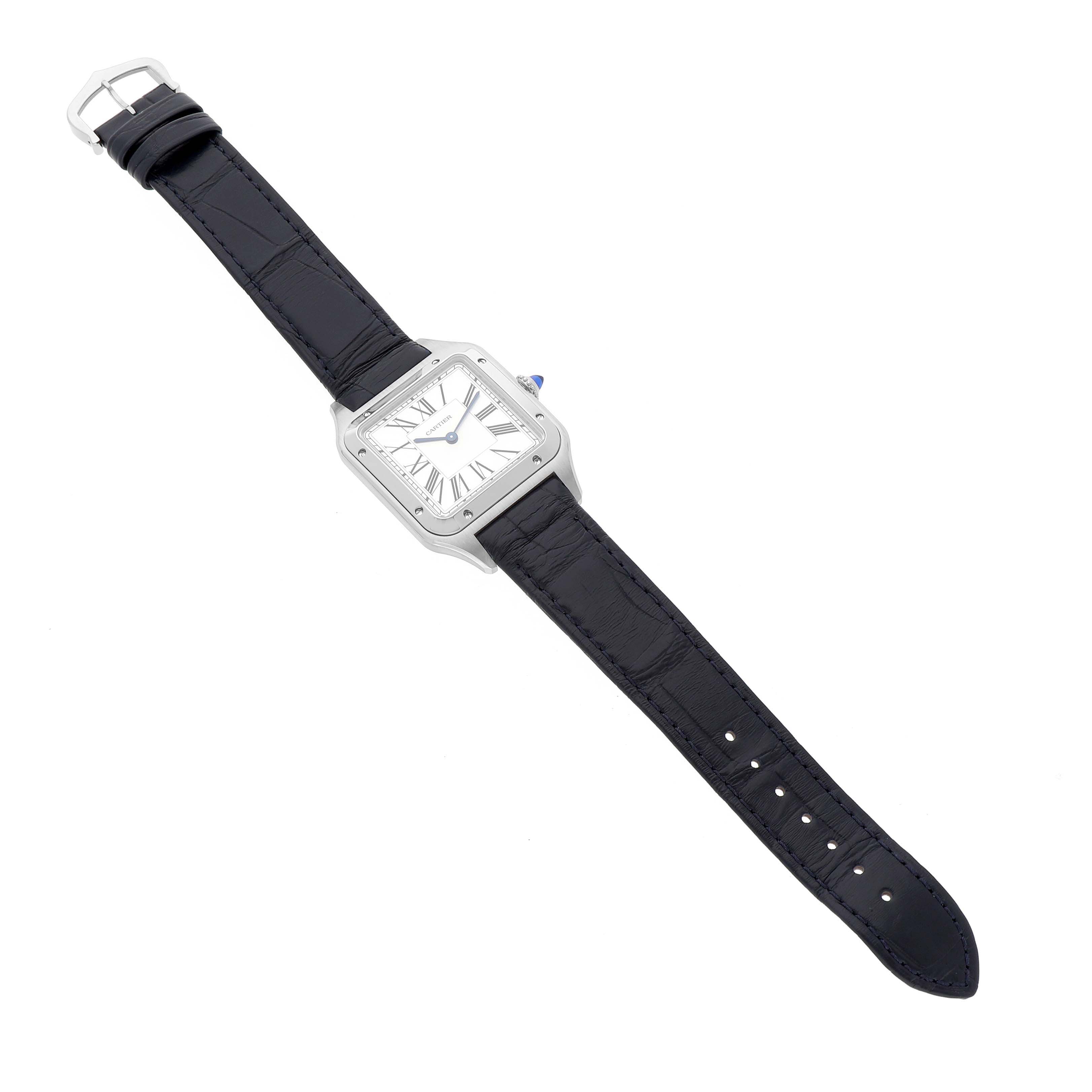 The Cartier Santos Dumont WSSA0085 Men's Stainless Steel Silver Dial watch is shown from a top-down angle, displaying the full strap and square face with Roman numerals.