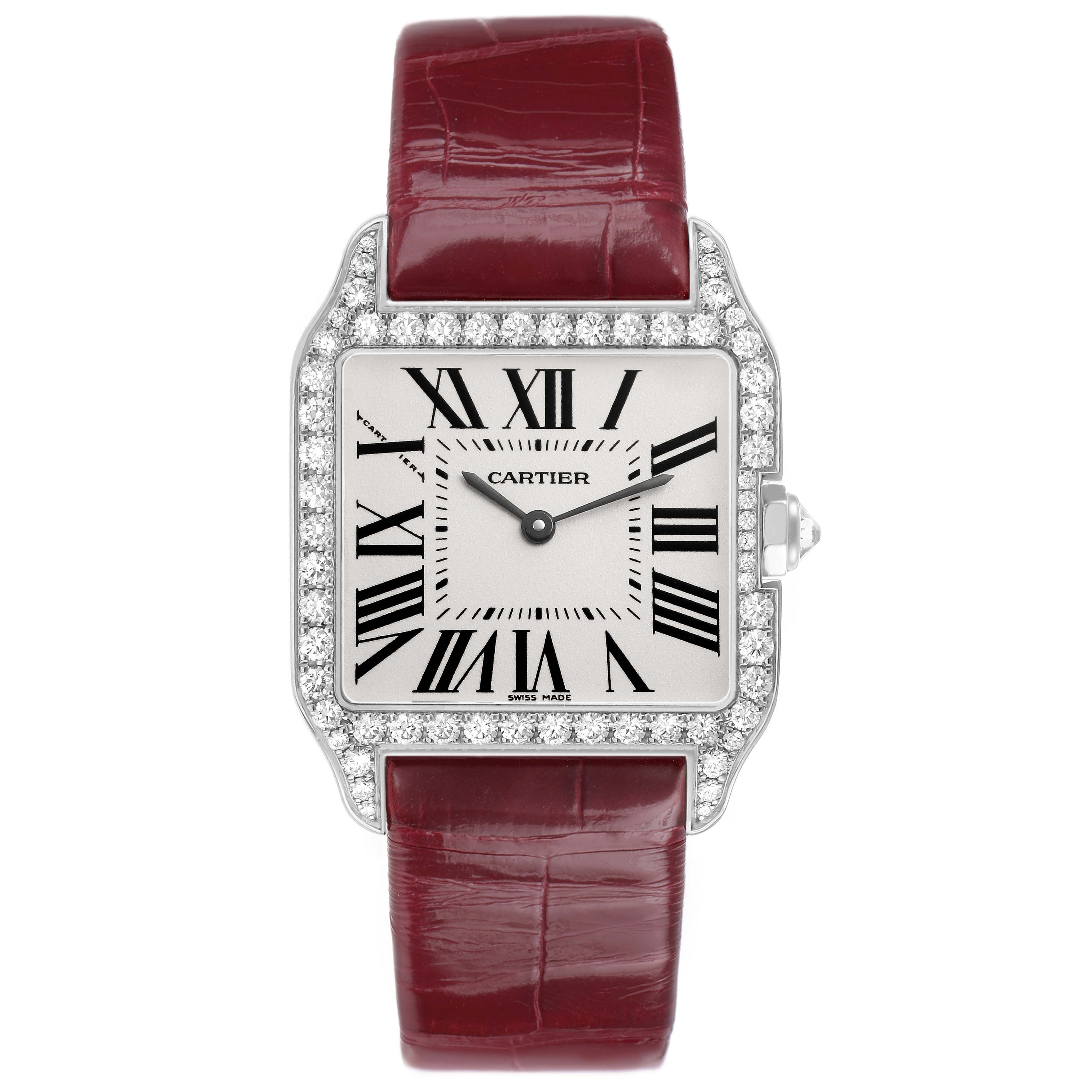 The Cartier Santos Dumont WH100251 Men's White Gold Silver Dial watch is shown front-facing with a diamond-encrusted bezel and a red strap.