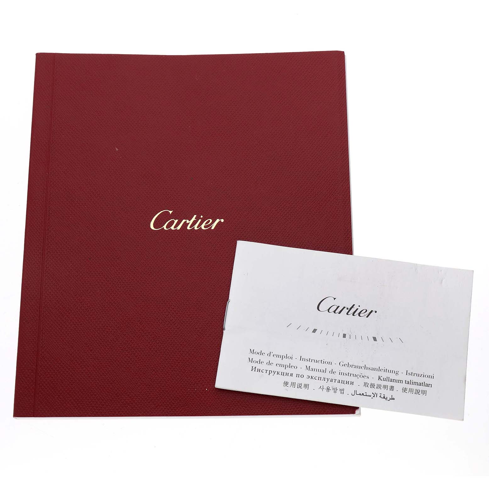 The image shows Cartier Santos W2SA0008 Men's Stainless Steel Silver Dial watch documentation, including a red booklet and a white instruction manual.