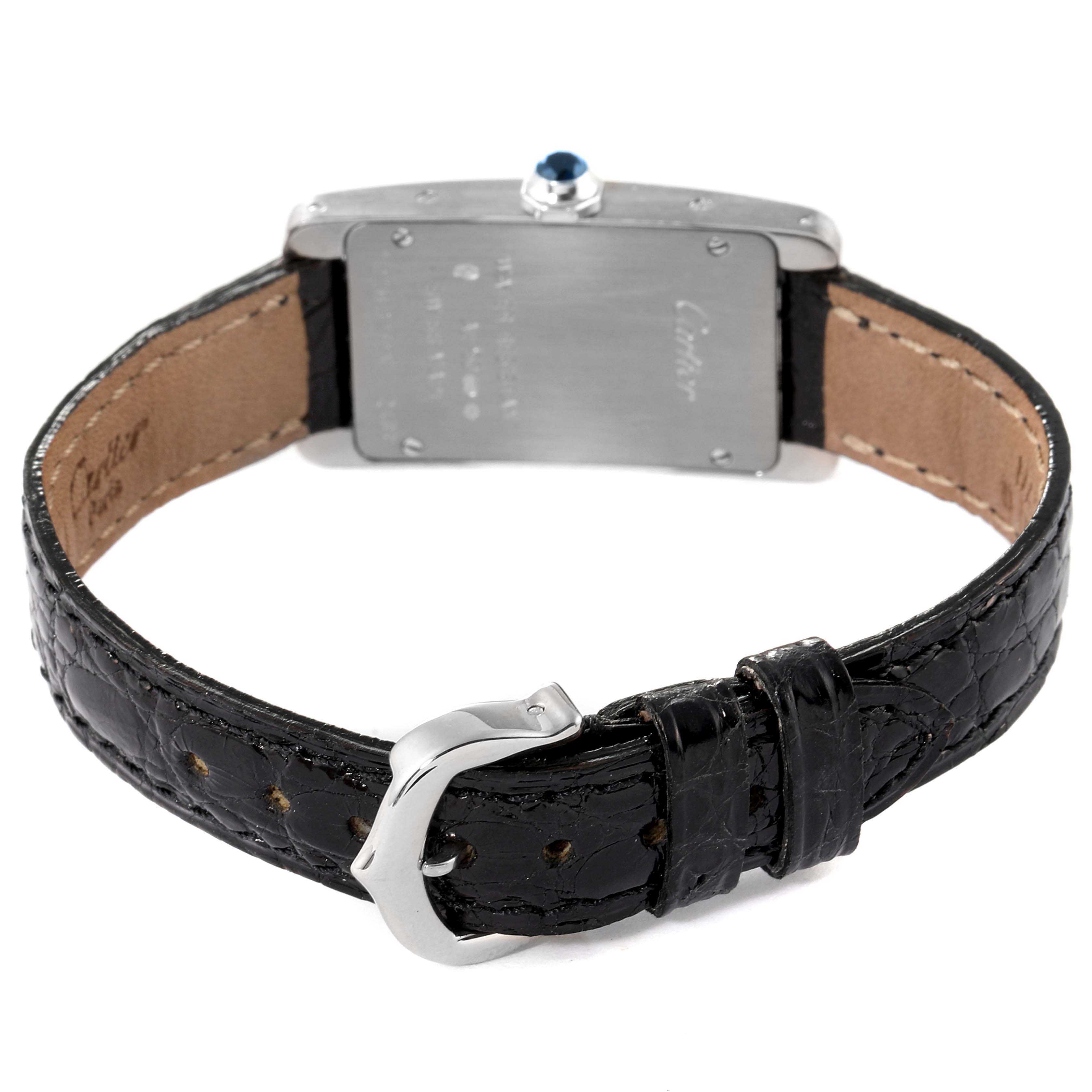 The image shows the back view of a Cartier Tank Americaine W2601956 Women's White Gold Silver Dial W2601956 Women's White Gold Silver Dial watch, highlighting its leather strap and buckle.