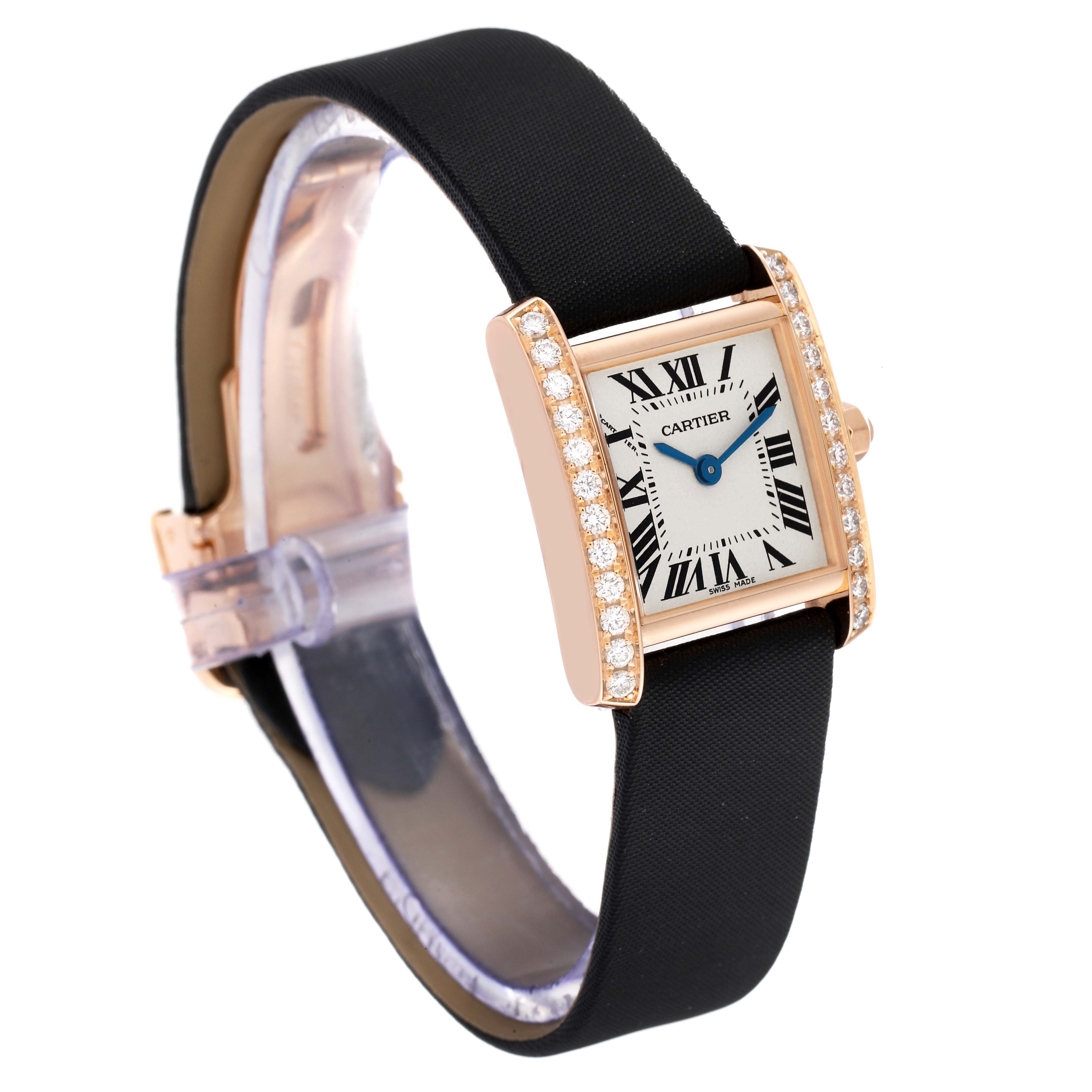 The image shows a Cartier Tank Francaise WE104531 Women
s Rose Gold Silver Dial WE104531 Women
s Rose Gold Silver Dial watch at an angle, highlighting the watch face, diamond bezel, and black strap.
