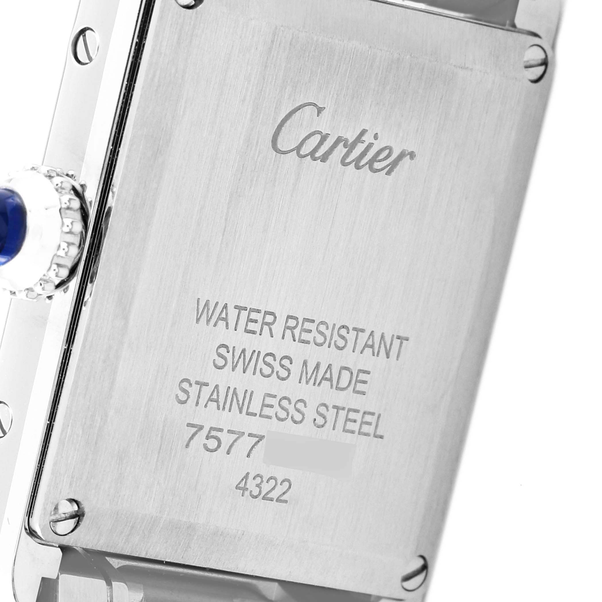This image shows the back case of a Cartier Tank Must WSTA0051 Women
s Stainless Steel Silver Dial WSTA0051 Women
s Stainless Steel Silver Dial watch, highlighting its water resistance, Swiss origin, and stainless steel construction.