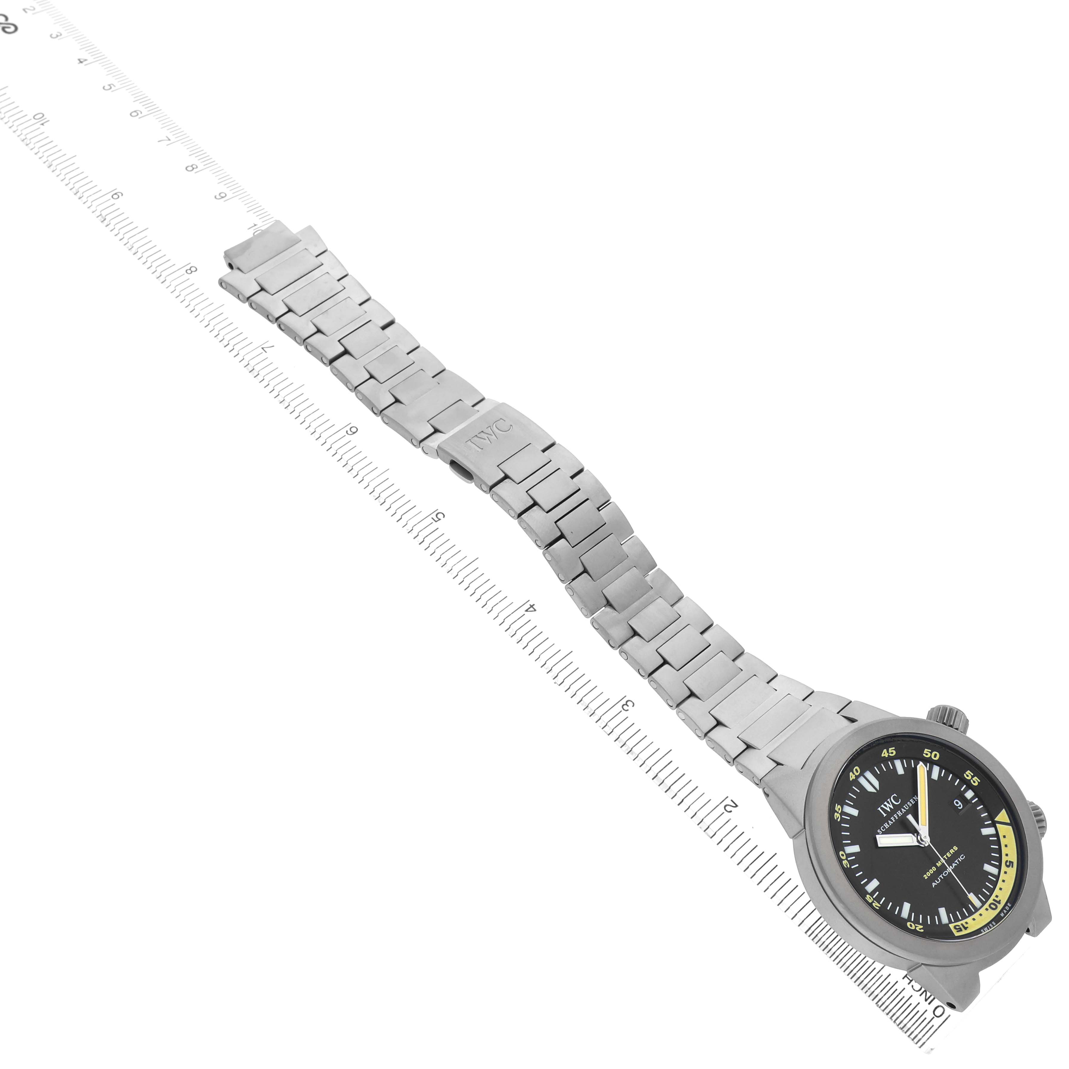 The image shows an IWC Aquatimer IW353803 Men's Titanium Black Dial watch at an oblique angle, highlighting its bracelet, clasp, and face.