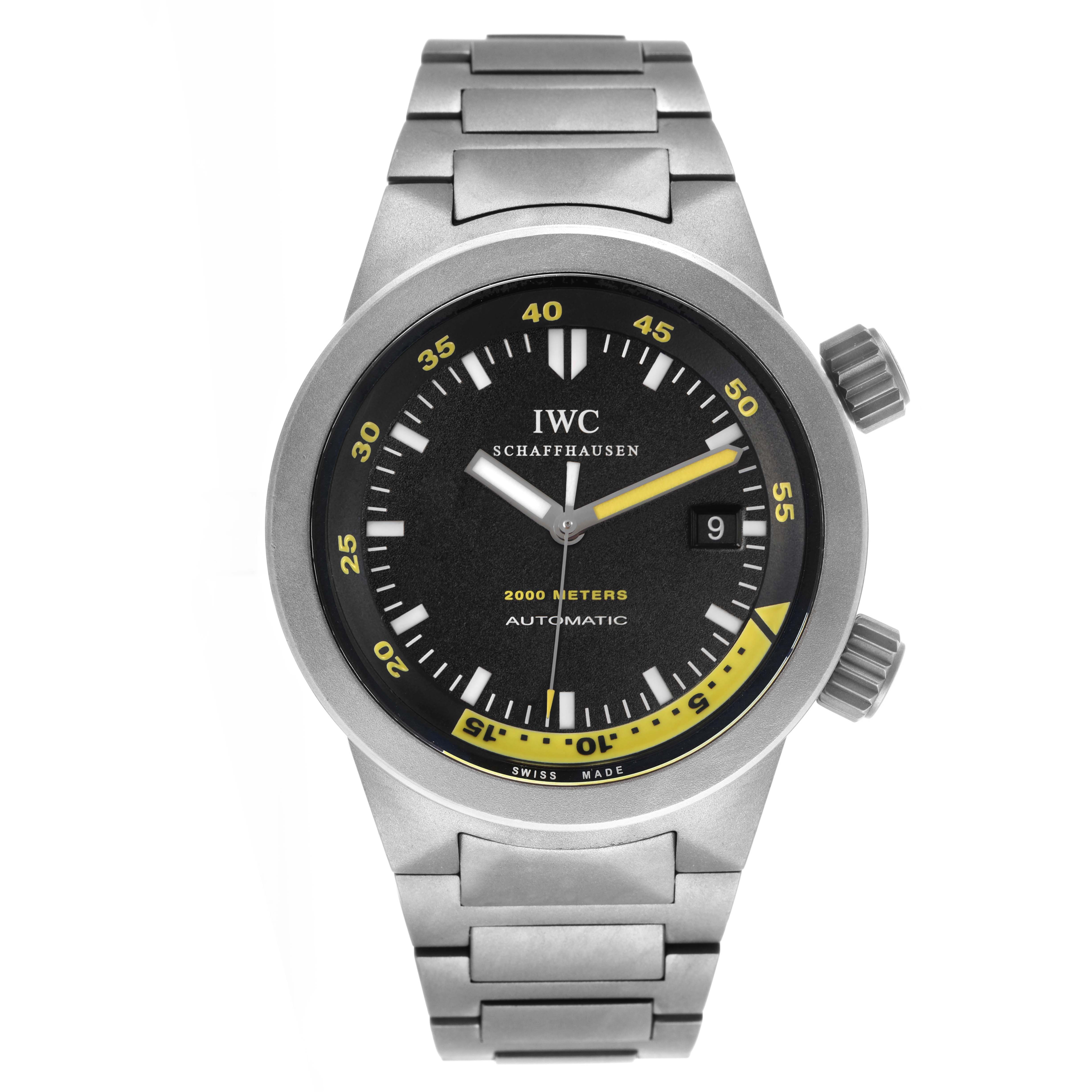 The IWC Aquatimer IW353803 Men's Titanium Black Dial watch is shown from a top-down angle, highlighting the dial, bezel, and metal strap.