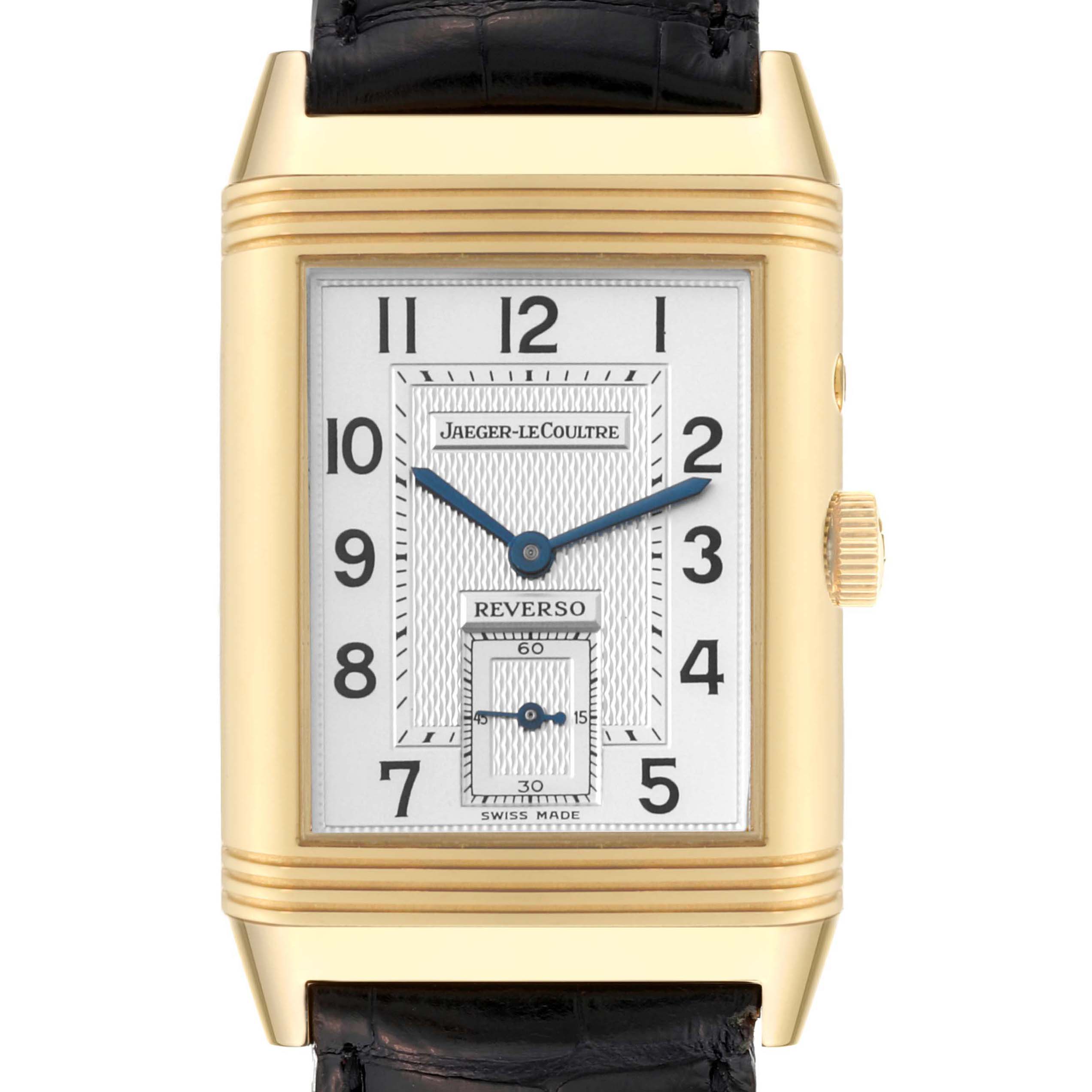 The image shows a front view of a Jaeger-LeCoultre Reverso watch highlighting the watch face, dial, and strap.