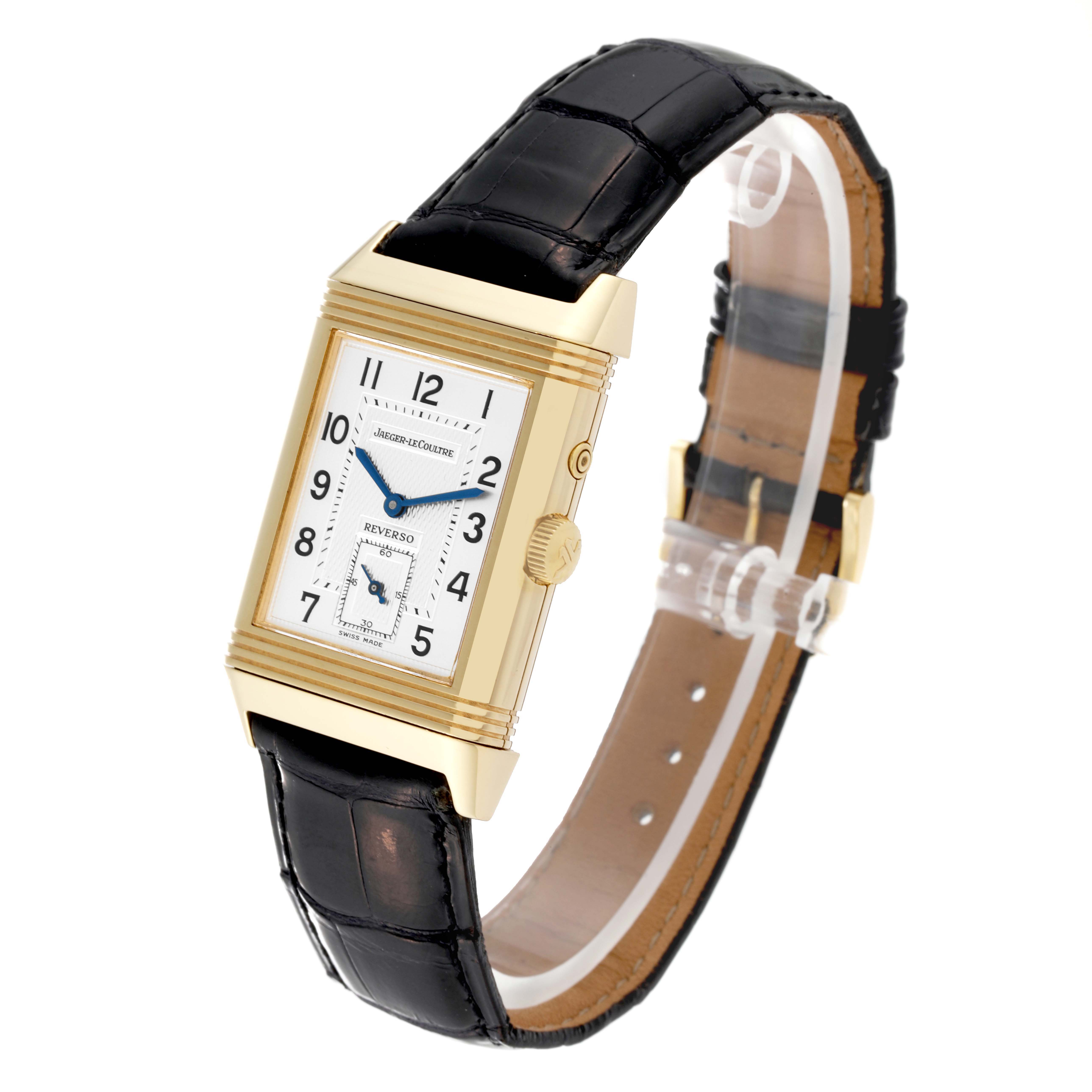 The watch is a Jaeger LeCoultre Reverso 270.1.54 Men's Yellow Gold Red Dial 270.1.54 Men's Yellow Gold Red Dial, shown at a three-quarter angle highlighting the face, crown, and black leather strap.