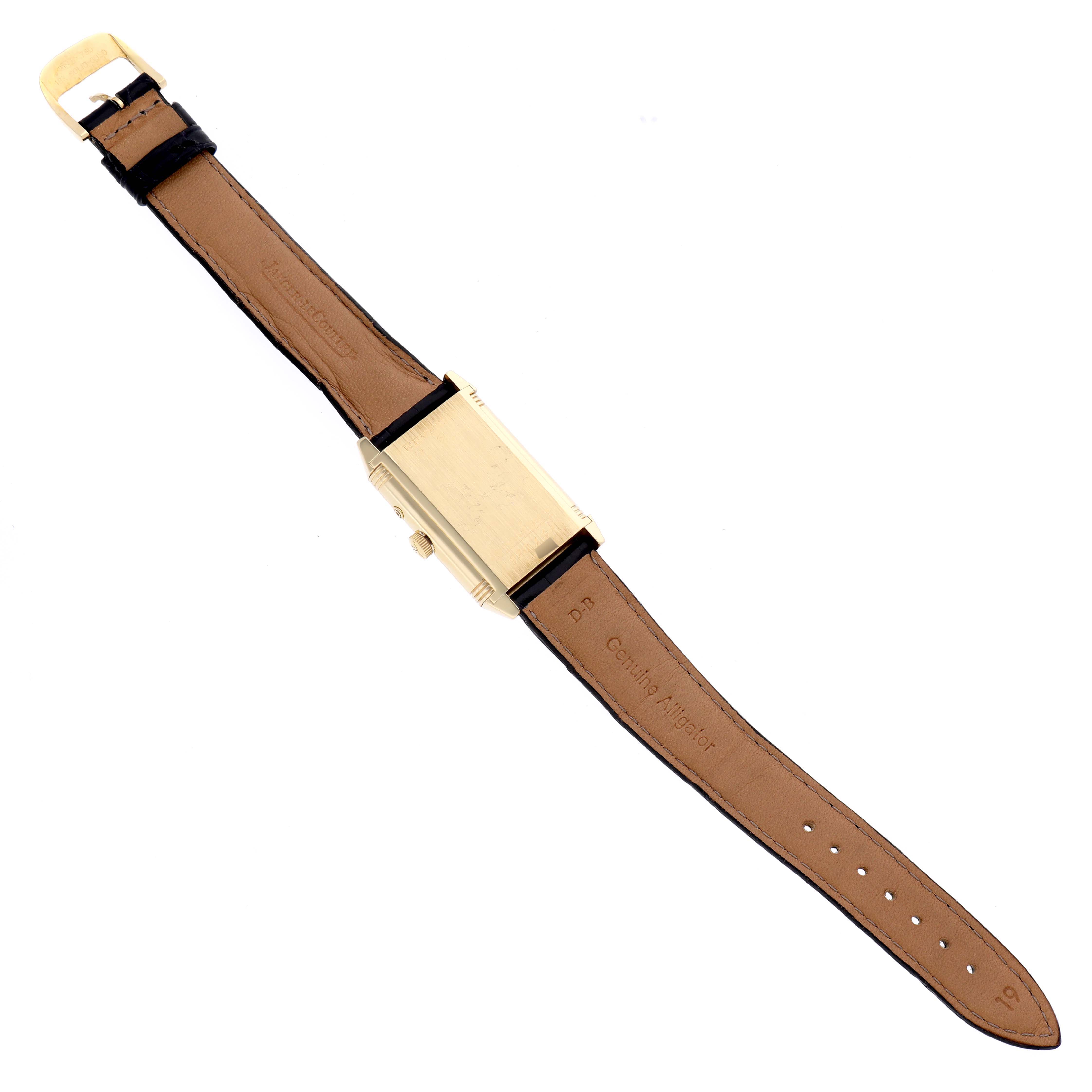 The image shows the reverse side of the Jaeger LeCoultre Reverso 270.1.54 Men's Yellow Gold Red Dial 270.1.54 Men's Yellow Gold Red Dial watch, including its tan leather strap and gold case.