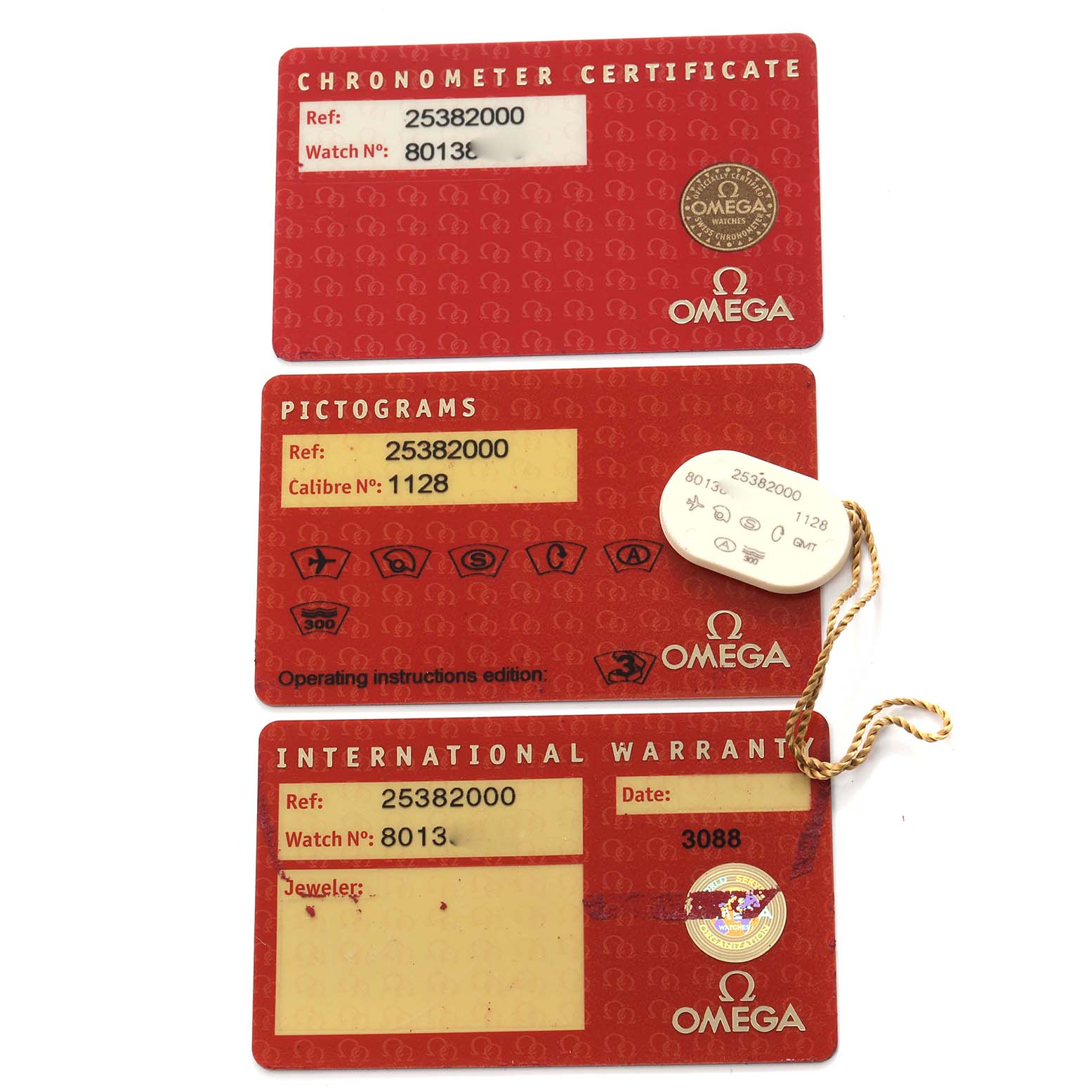 The image shows Omega Seamaster 2538.20.00 Men
s Stainless Steel White Dial 2538.20.00 Men
s Stainless Steel White Dial watch accessories: chronometer certificate, pictograms card, international warranty, and a tag.